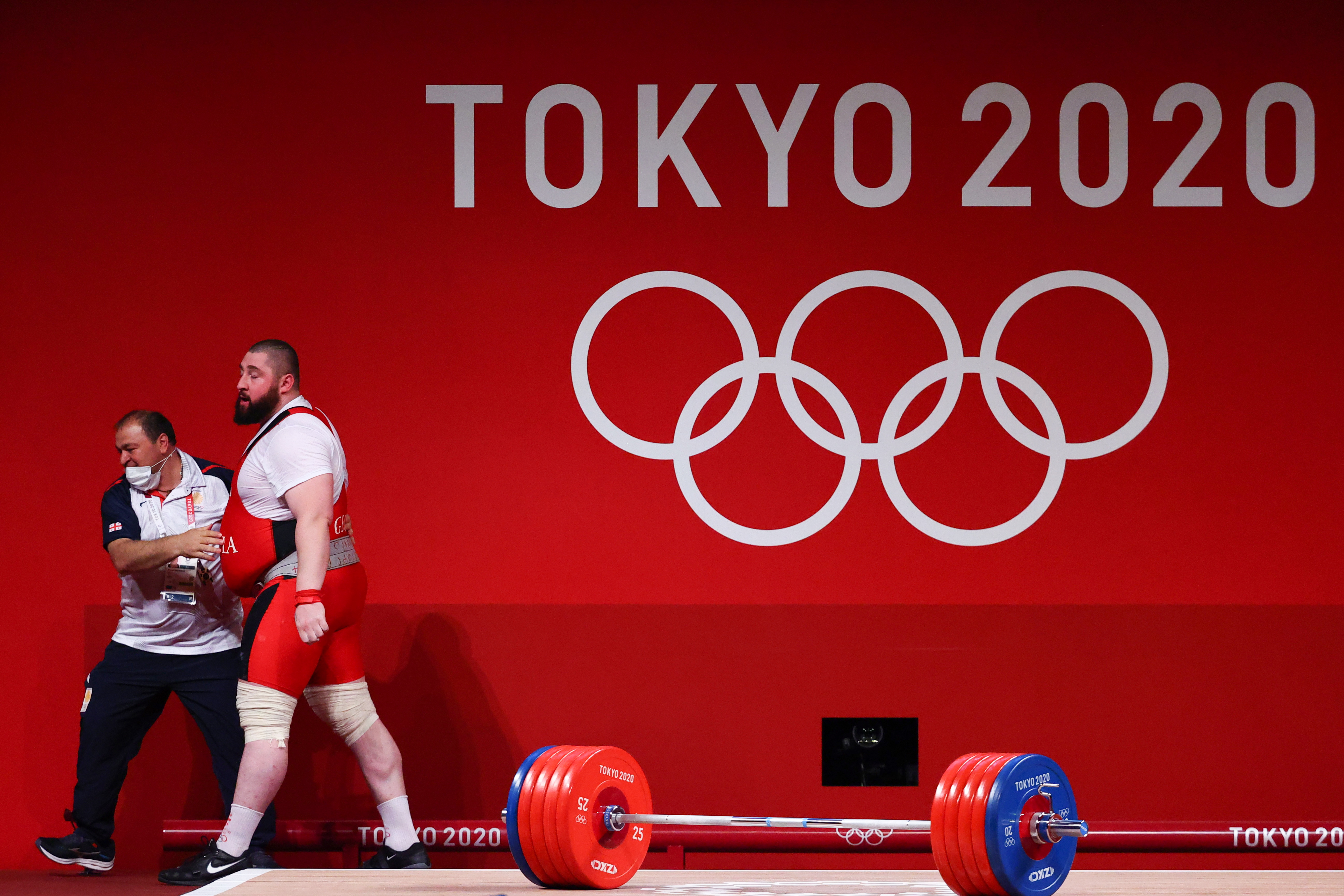 Tokyo 2020 Olympics - Weightlifting - Men's +109kg - Group A - Tokyo International Forum, Tokyo, Japan - August 4, 2021. Lasha Talakhadze of Georgia celebrates with coach Avtandil Gaklokisze. REUTERS/Edgard Garrido