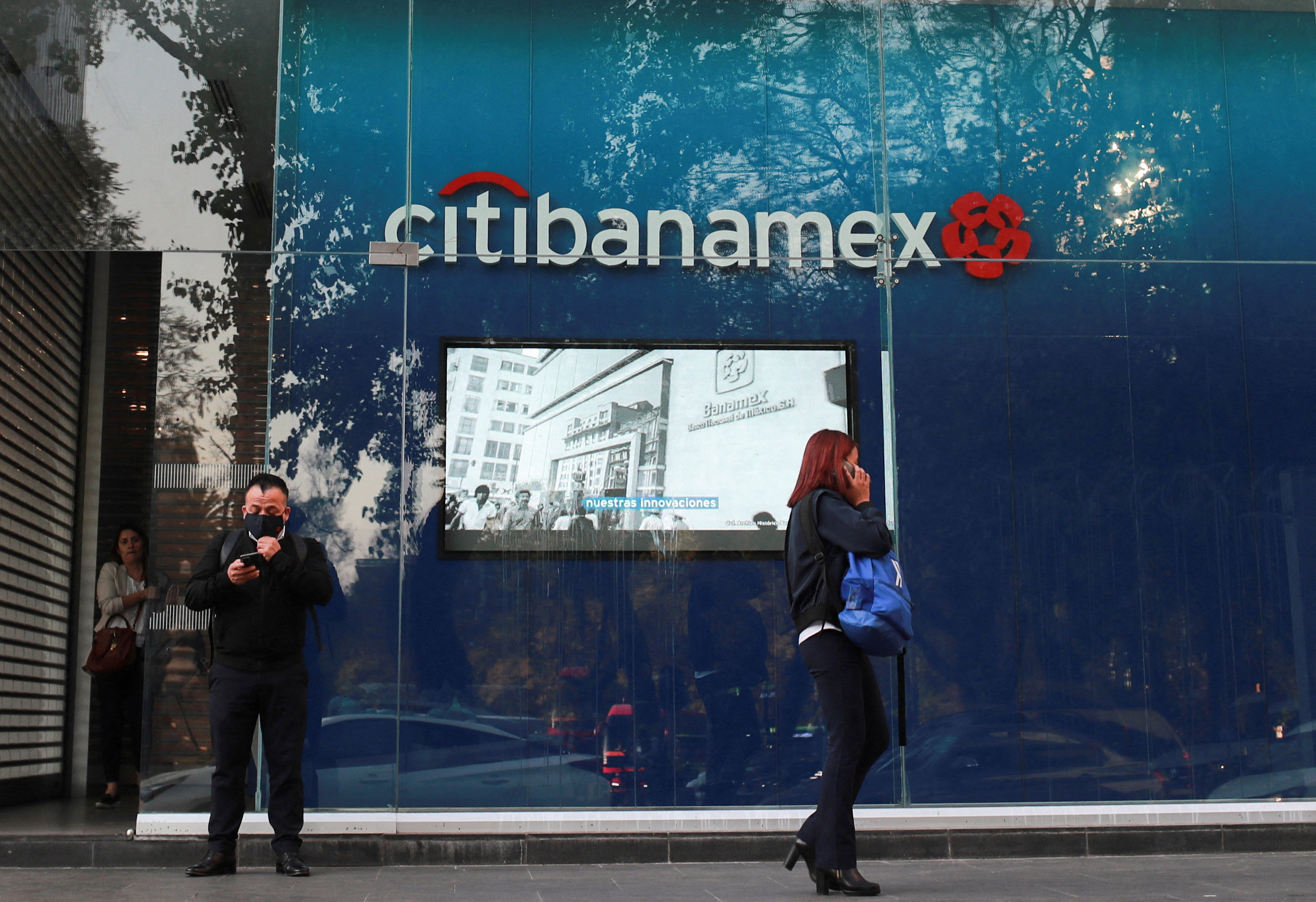 FILE PHOTO: People stand outside a Citibanamex bank branch in Mexico City, Mexico January 30, 2023. REUTERS/Henry Romero/File Photo