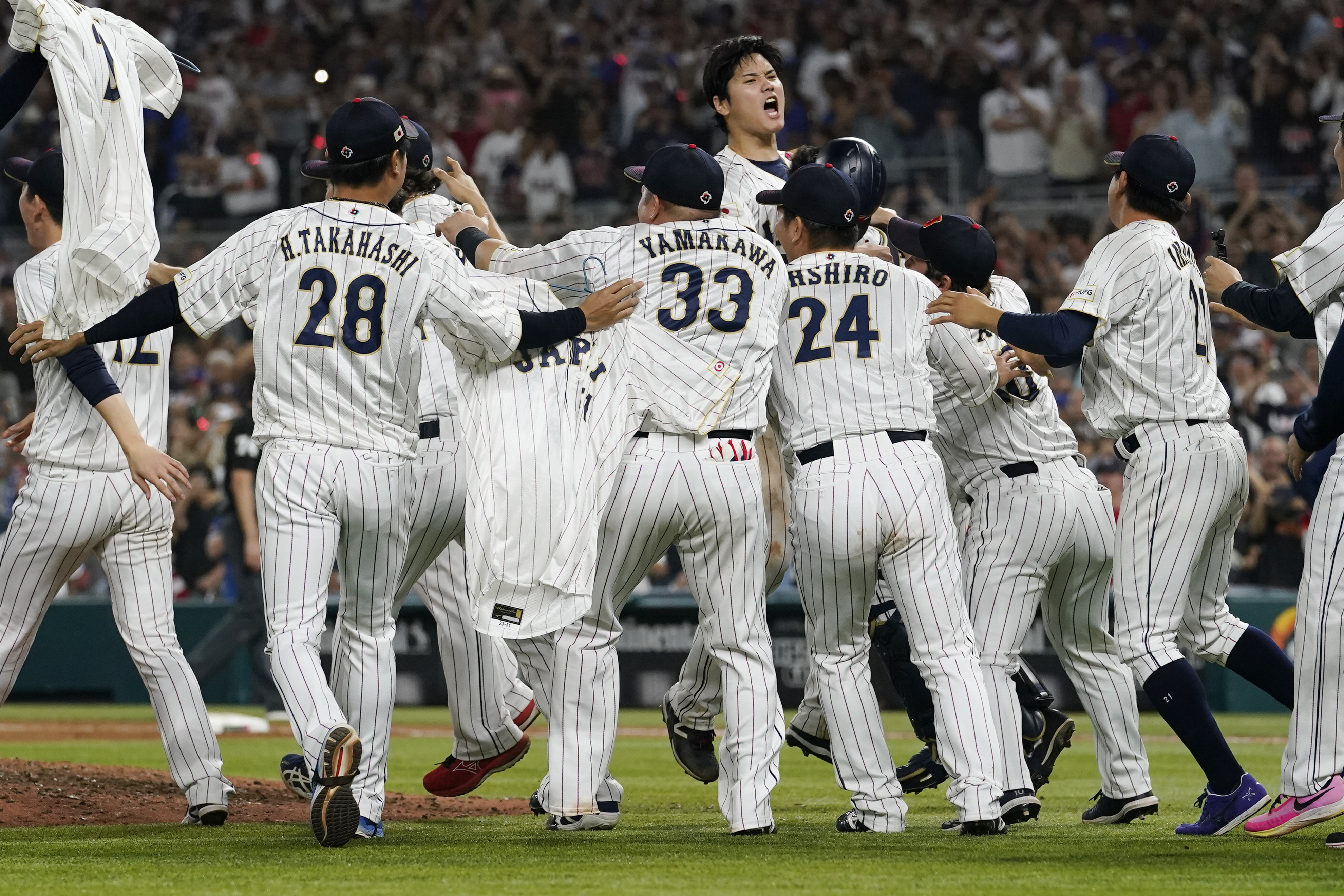 Japan's players celebrate their 3-2 victory over the United States in the final of the World Baseball Classic, Tuesday, March 21, 2023, in Miami.  (AP Photo/Marta Lavandier)