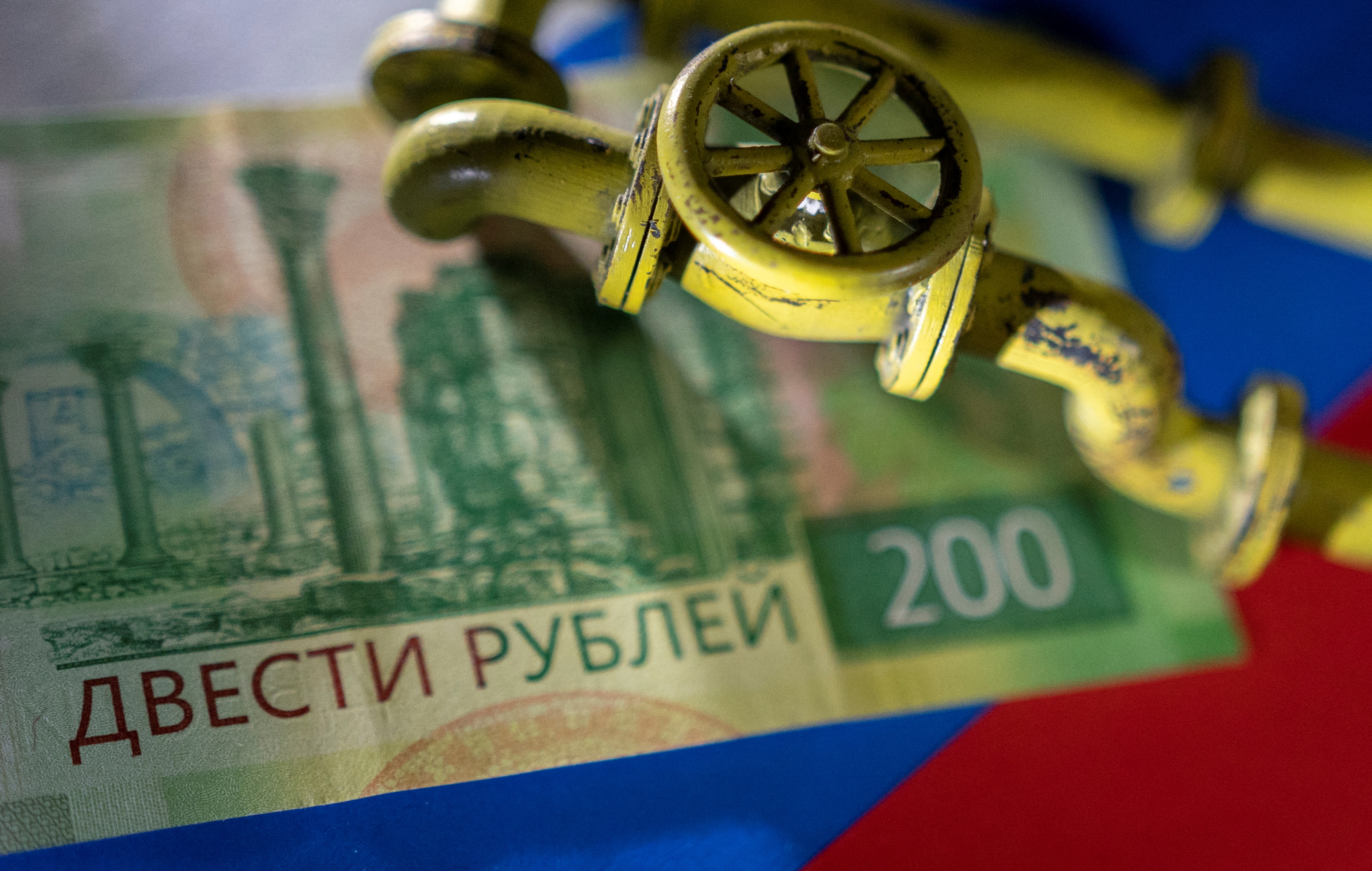 Illustration shows natural gas pipeline, Russian Rouble banknote and flag