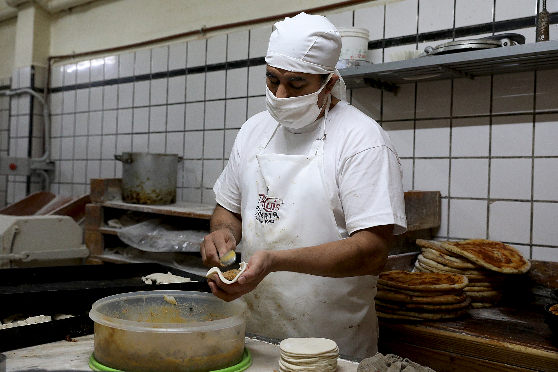 Los maestros pizzeros también trabajan con barbijo