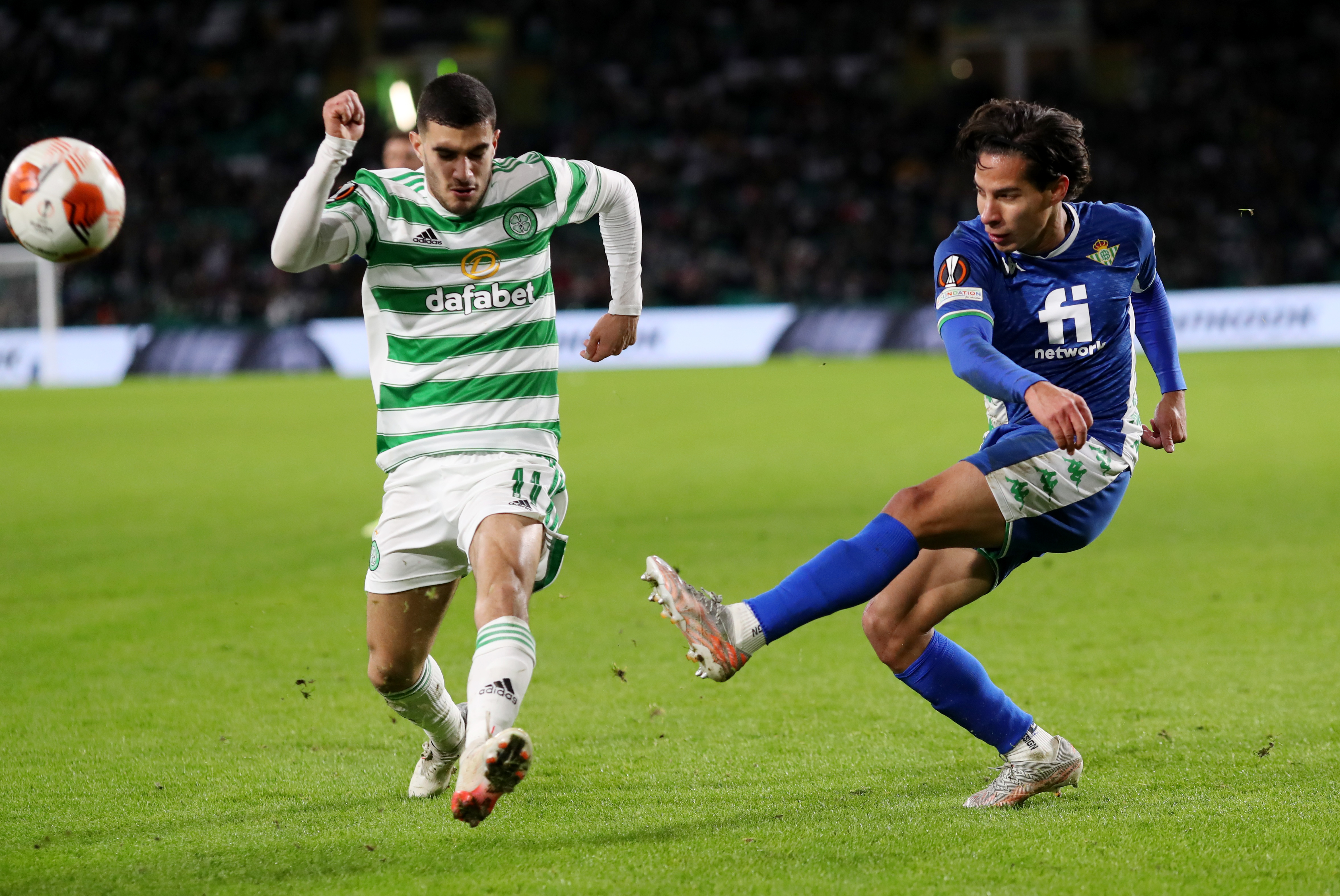 Soccer Football - Europa League - Group G - Celtic v Real Betis - Celtic Park, Glasgow, Scotland, Britain - December 9, 2021 Celtic's Liel Abada in action with Real Betis' Diego Lainez REUTERS/Russell Cheyne