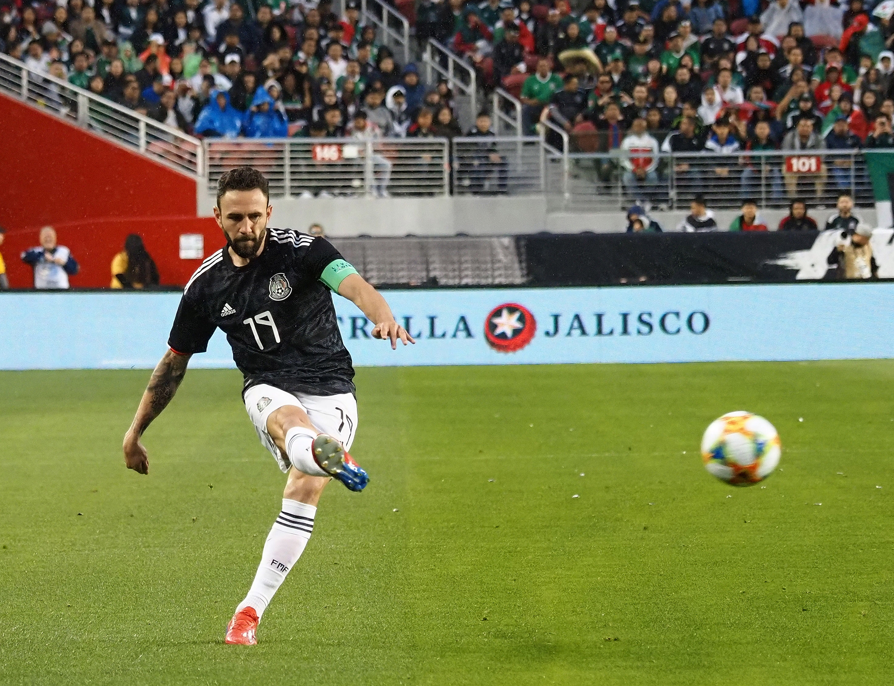 Mar 26, 2019; Santa Clara, CA, USA; Mexico defender Miguel Layun (19) kicks the ball against Paraguay during the first half at Levi's Stadium. Mandatory Credit: Kelley L Cox-USA TODAY Sports