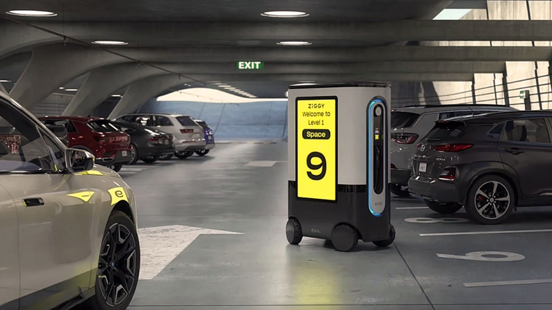 Cuando el usuario llega al sitio reservado, el robot se desplaza hacia atrás para permitir el estacionamiento y luego se acerca a la boca de carga