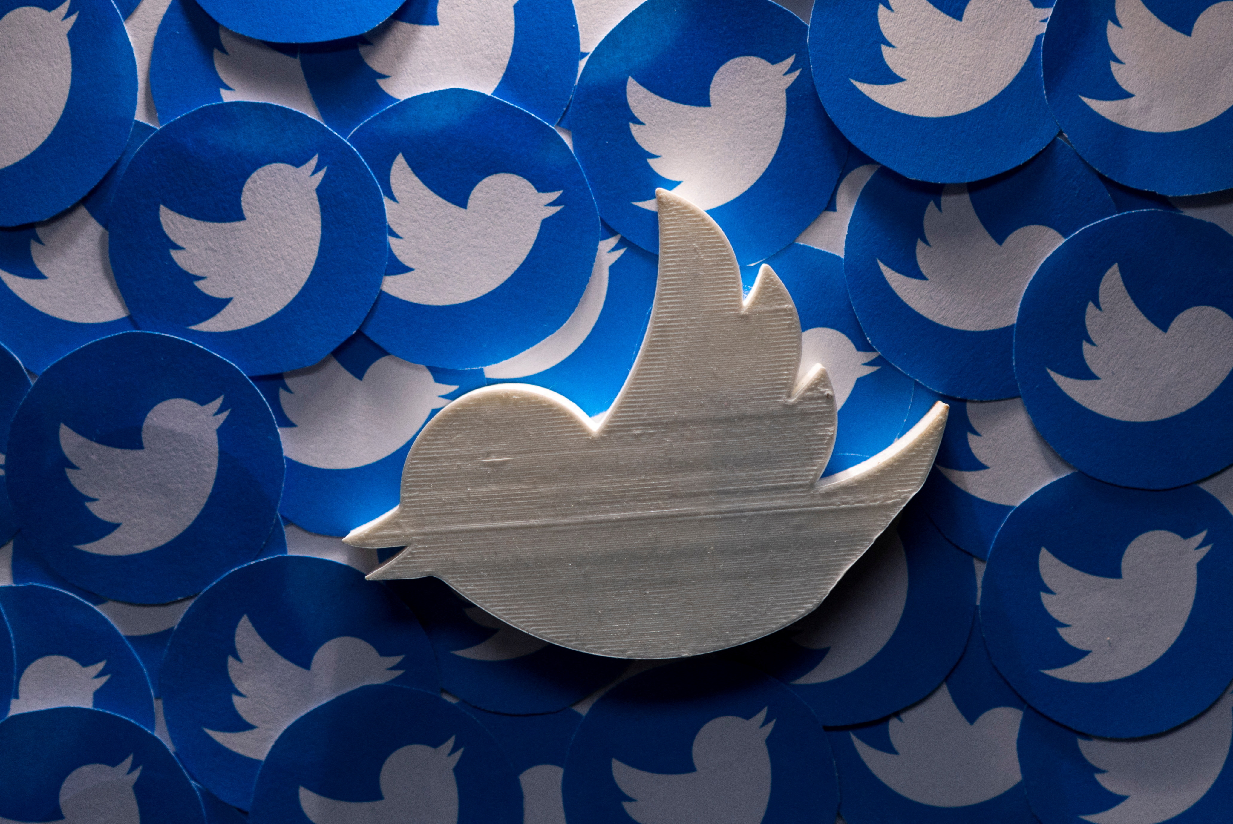 FILE PHOTO: A 3D-printed Twitter logo on non-3D printed Twitter logos is seen in this picture illustration taken April 28, 2022. REUTERS/Dado Ruvic/Illustration/File Photo