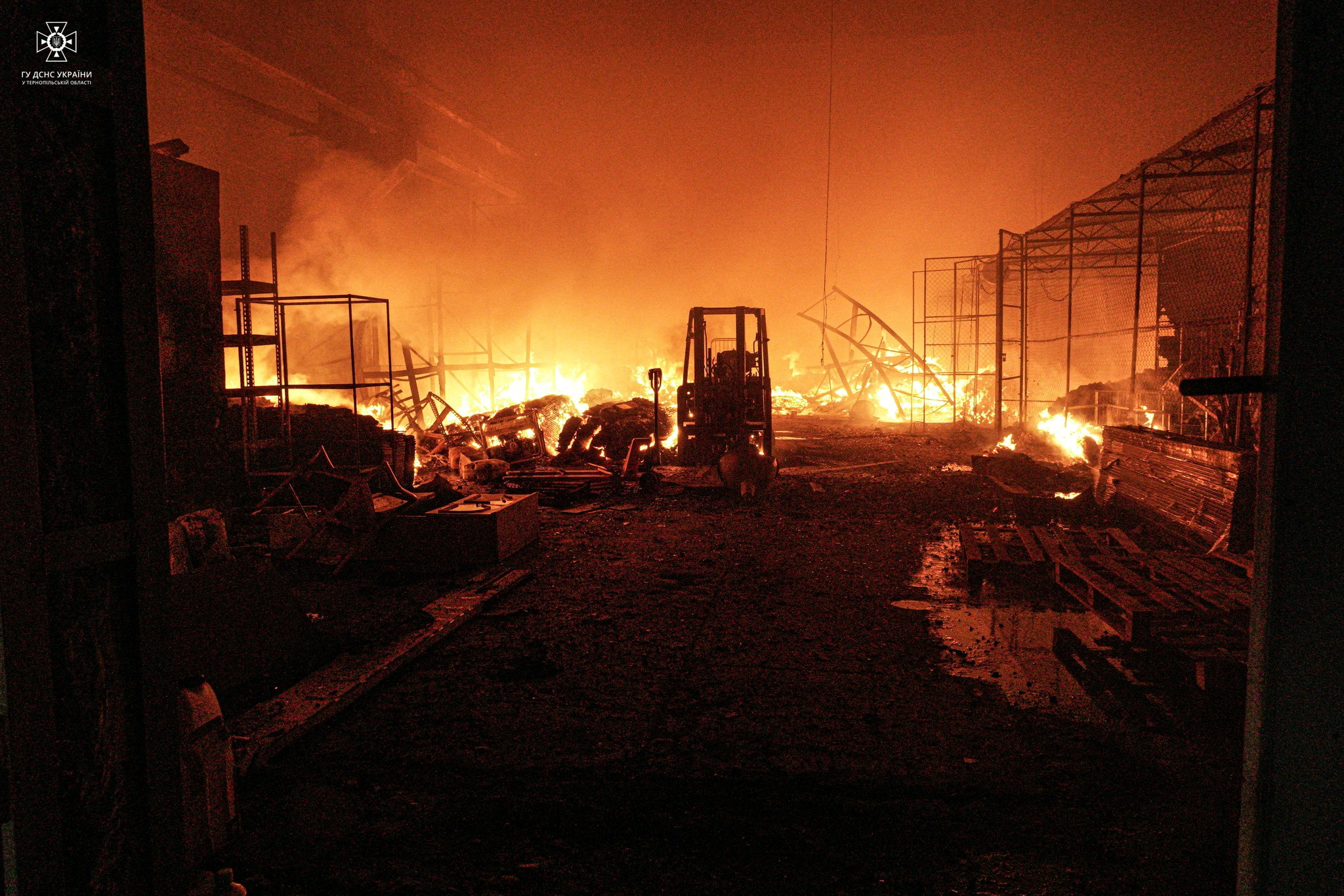 A burning warehouse after a Russian missile attack (via Reuters)