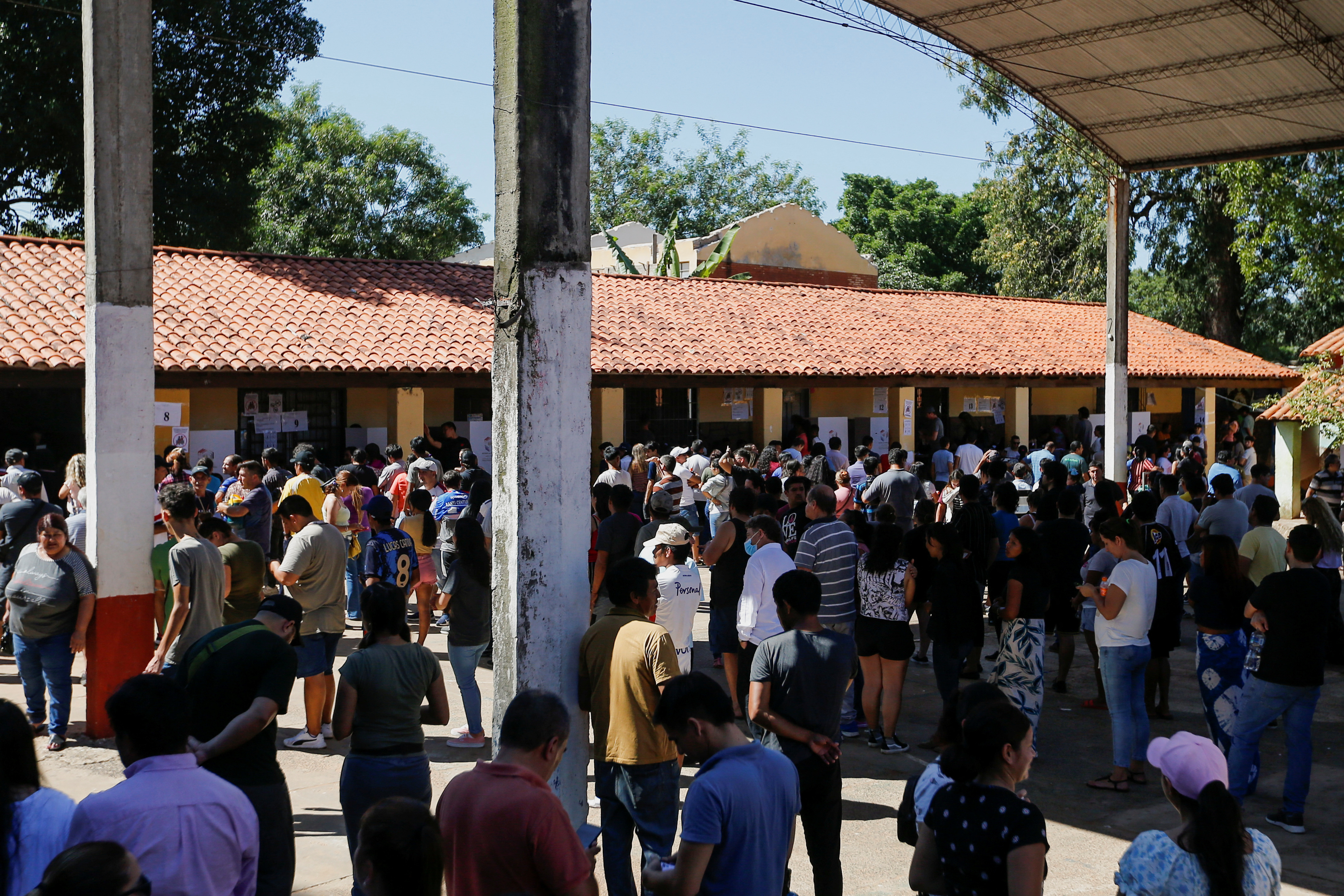 People queue at a polling station during Paraguay's general elections, in Mariano Roque Alonso, Paraguay April 30, 2023. REUTERS/Cesar Olmedo