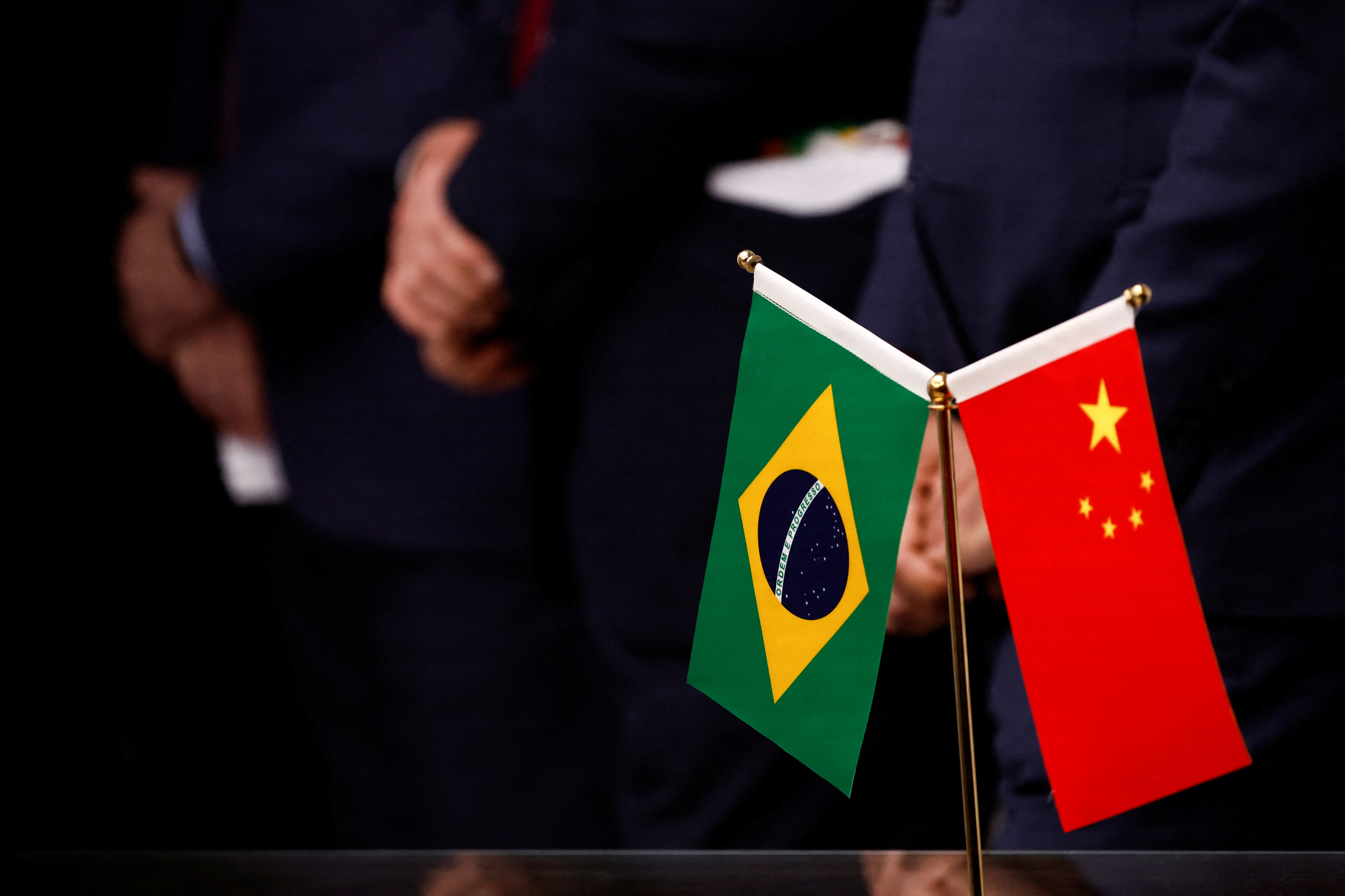 Flags are seen as Brazil's President Luiz Inacio Lula da Silva holds a news conference following his meeting with Chinese President Xi Jinping, at the Brazilian Embassy in Beijing, China April 14, 2023. REUTERS/Tingshu Wang/Pool