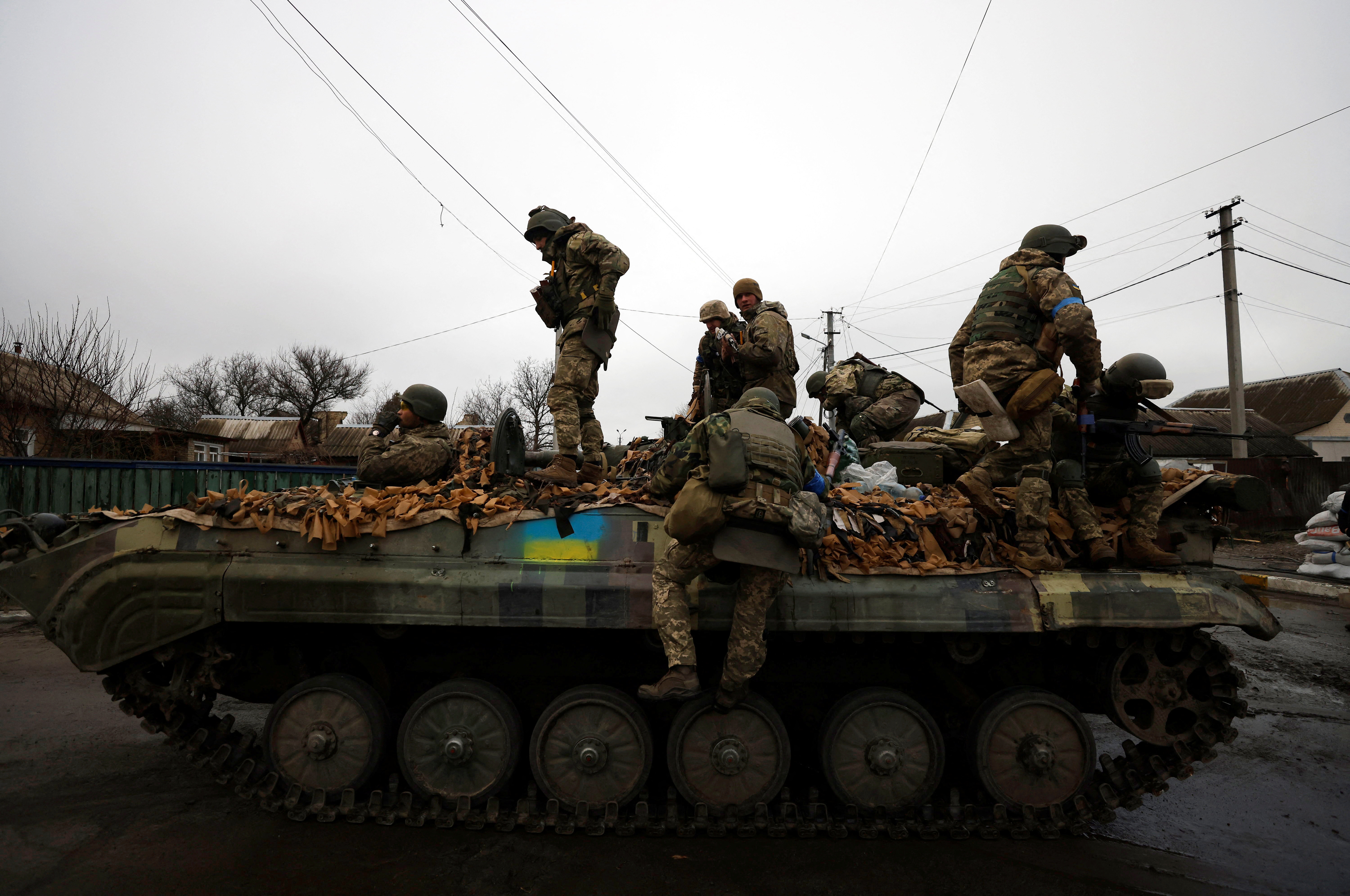 Ukrainian soldiers are pictured in their military vehicle, amid Russia's invasion on Ukraine in Bucha, in Kyiv region, Ukraine April 2, 2022. REUTERS/Zohra Bensemra