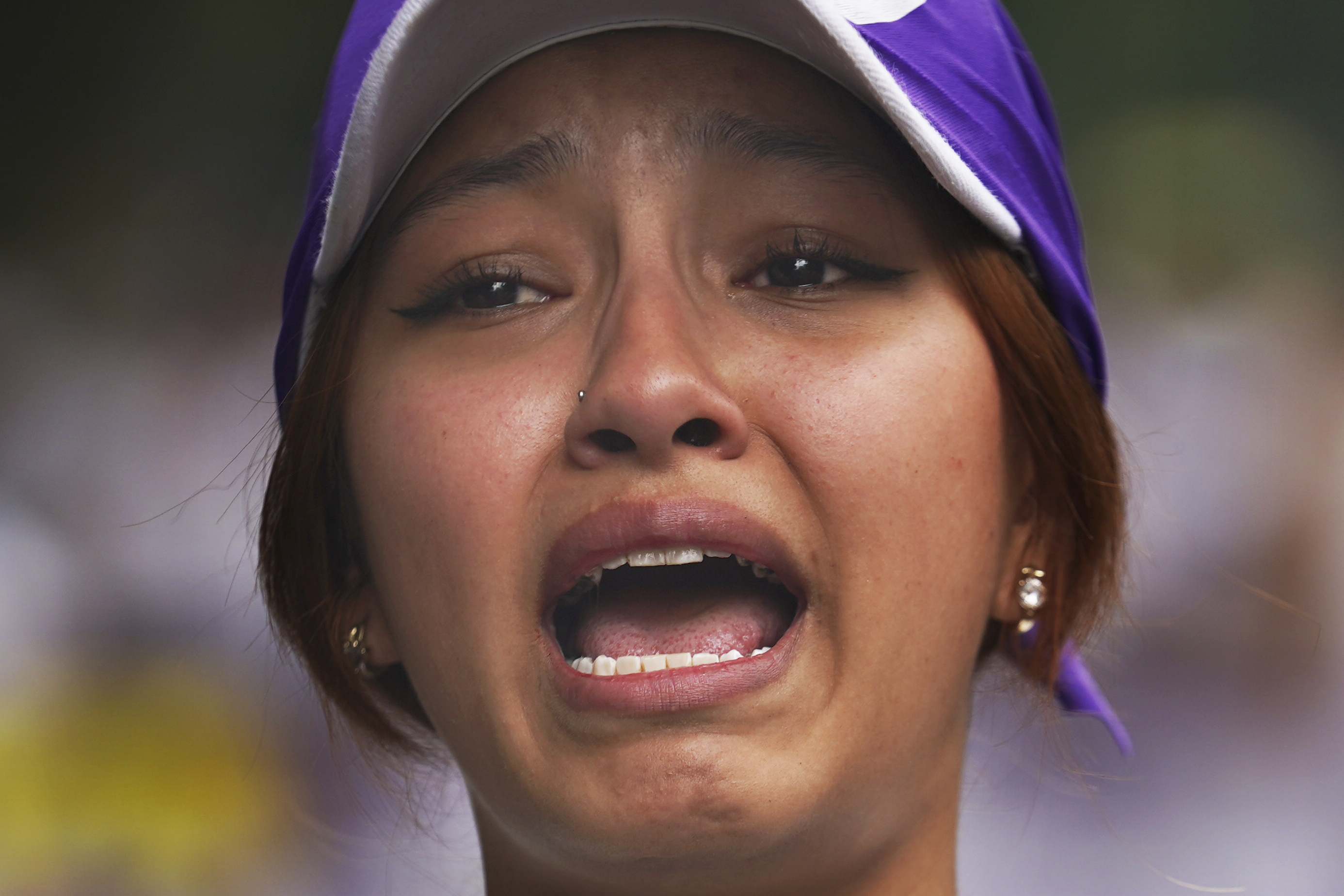 Vania Hernández Portillo, daughter of a disappeared woman, participates with mothers of the disappeared in a march to demand government help to find their loved ones, coinciding with the celebration of Mother's Day, in Mexico City, on May 10, 2023. (AP Photo/Marco Ugarte)