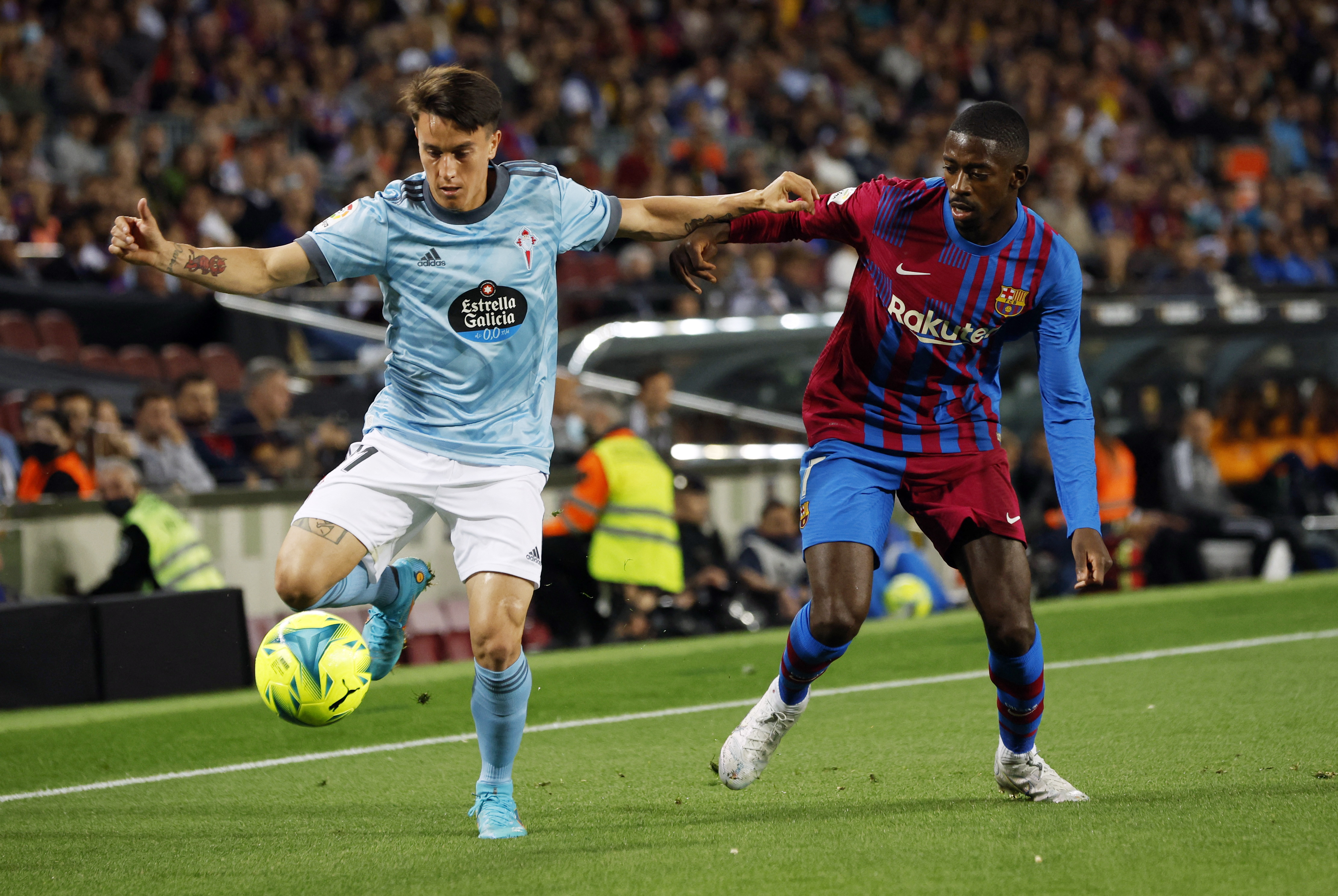 Soccer Football - LaLiga - FC Barcelona v Celta Vigo - Camp Nou, Barcelona, Spain - May 10, 2022 Celta Vigo's Franco Cervi in action with FC Barcelona's Ousmane Dembele REUTERS/Albert Gea
