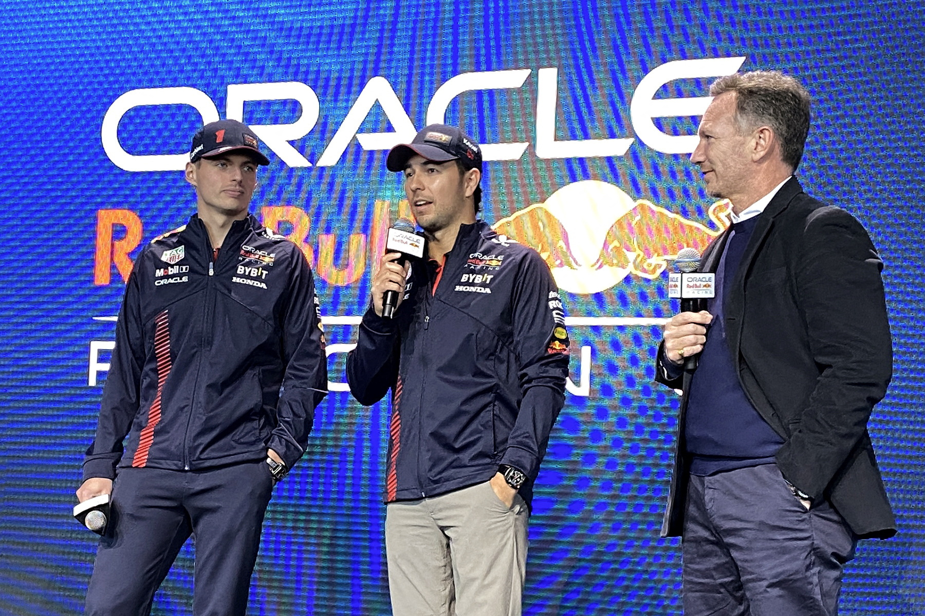 Drivers Max Verstappen, Sergio Perez and team principal Christian Horner of Red Bull F-1 Racing Team attend the unveil of the RB19 car in a partnership with Ford during a launch event in New York City, U.S., February 3, 2023. REUTERS/Christine Kiernan