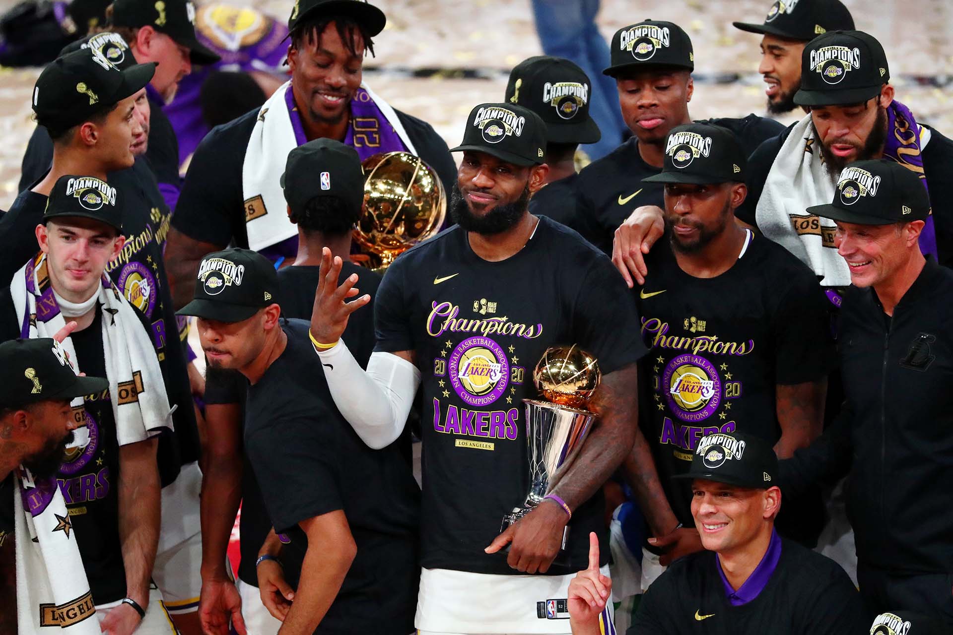 Oct 11, 2020; Lake Buena Vista, Florida, USA; Los Angeles Lakers forward LeBron James (23) holds up four fingers after winning his fourth NBA championship after game six of the 2020 NBA Finals at AdventHealth Arena. The Los Angeles Lakers won 106-93 to win the series. Mandatory Credit: Kim Klement-USA TODAY Sports