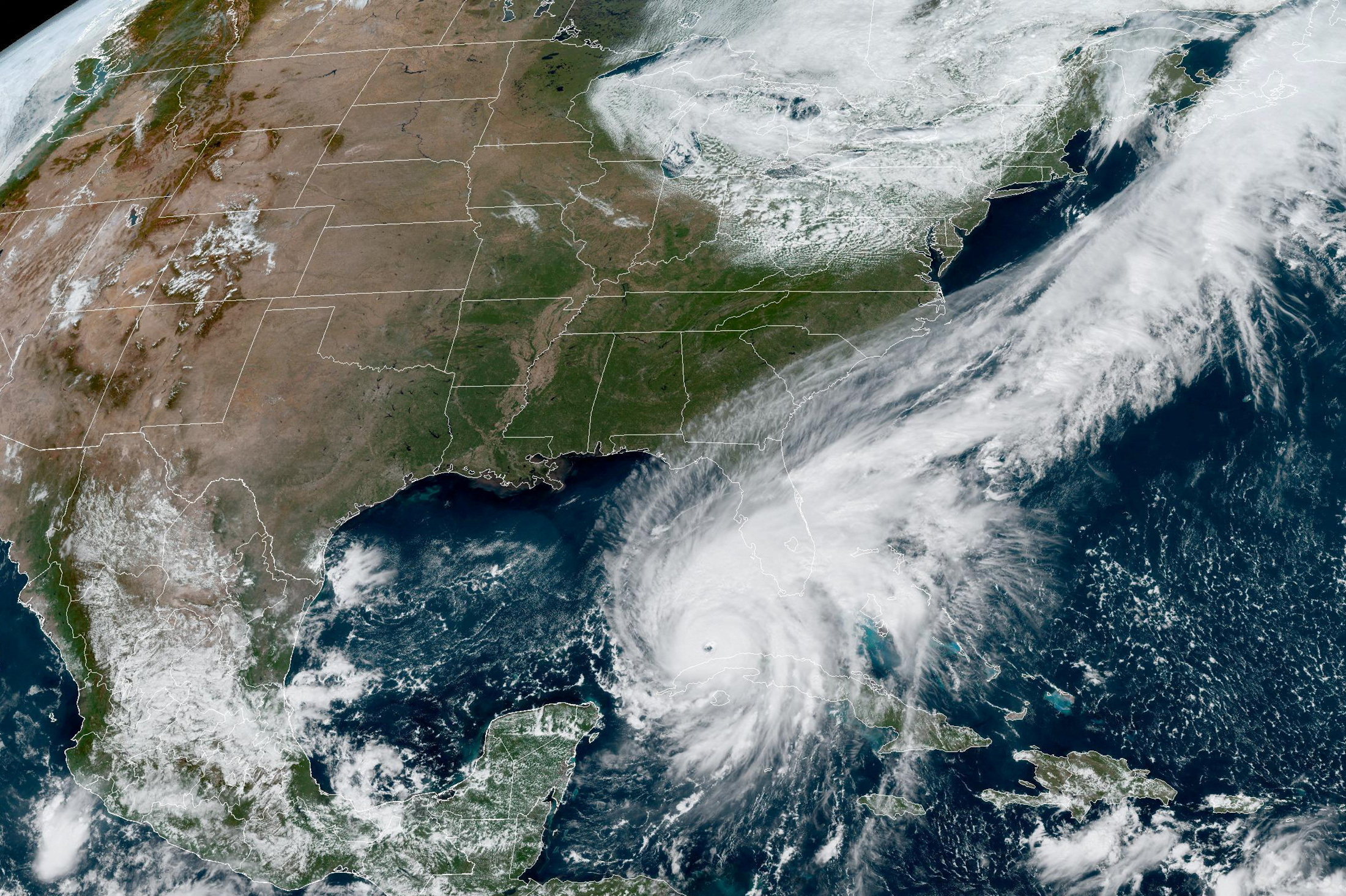 Hurricane Ian makes its way to Florida's west coast after passing Cuba in a composite image from the National Oceanic and Atmospheric Administration (NOAA) GOES-East weather satellite September 27, 2022. NOAA/Handout REUTERS  THIS IMAGE HAS BEEN SUPPLIED BY A THIRD PARTY.