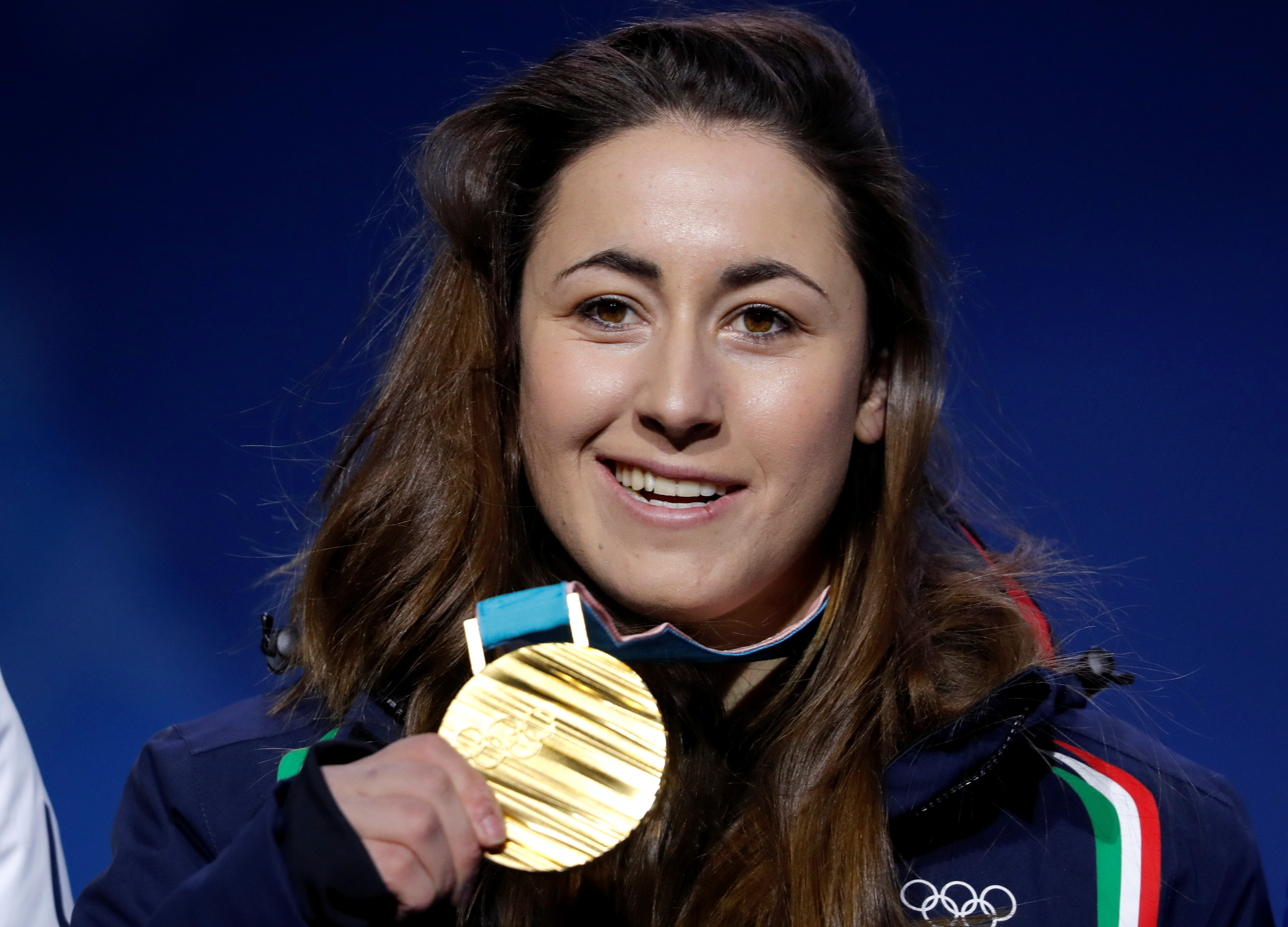 FILE PHOTO: Medals Ceremony - Alpine Skiing - Pyeongchang 2018 Winter Olympics - Women's Downhill - Medals Plaza - Pyeongchang, South Korea - February 21, 2018 - Gold medalist Sofia Goggia of Italy on the podium. REUTERS/Eric Gaillard/File Photo