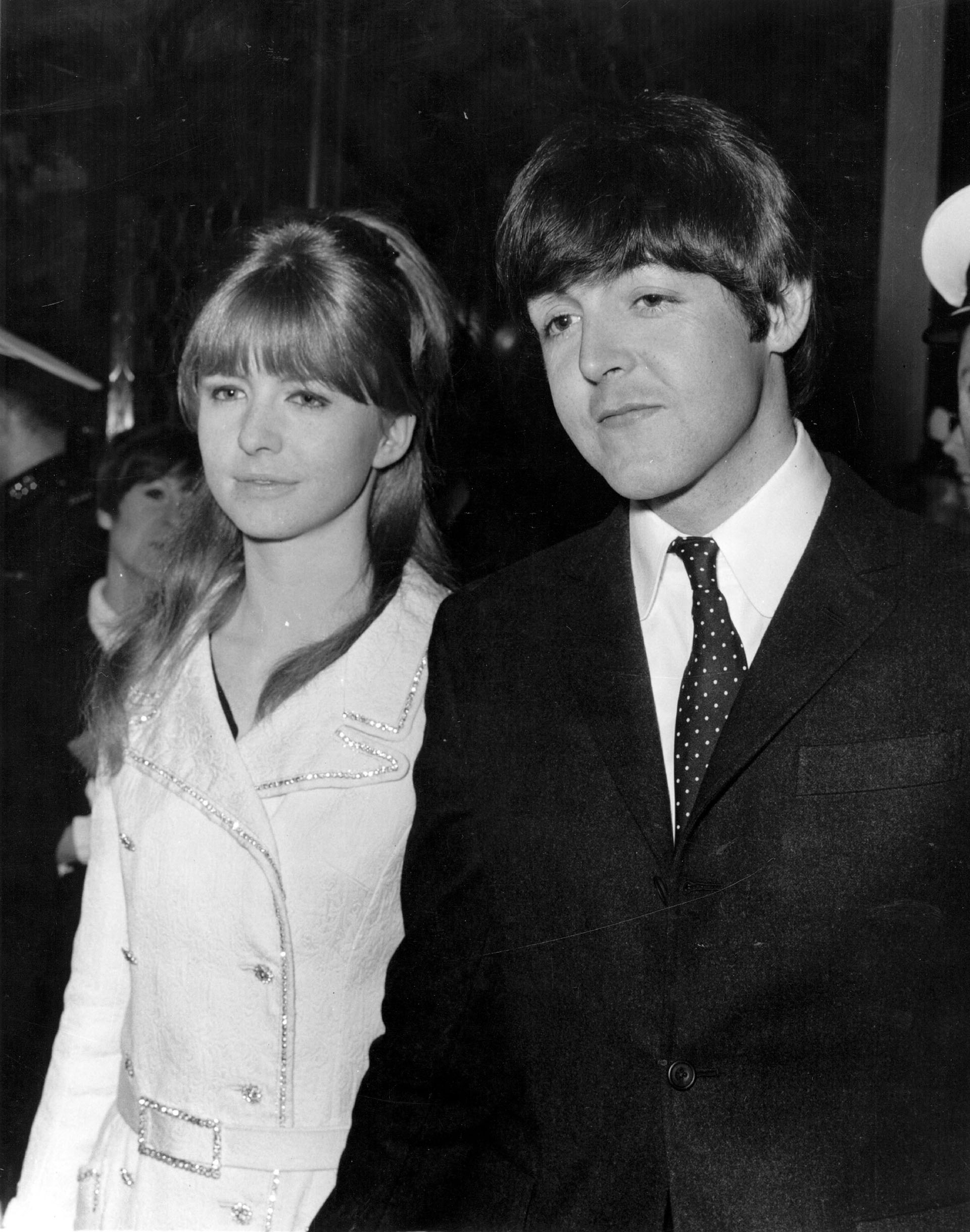 25th March 1966: Paul McCartney, singer and bass player with The Beatles arrives with his girlfriend, actress Jane Asher, at the premiere of Michael Caine's new film 'Alfie' at the Plaza Theatre, London. (Photo by Central Press/Getty Images)
