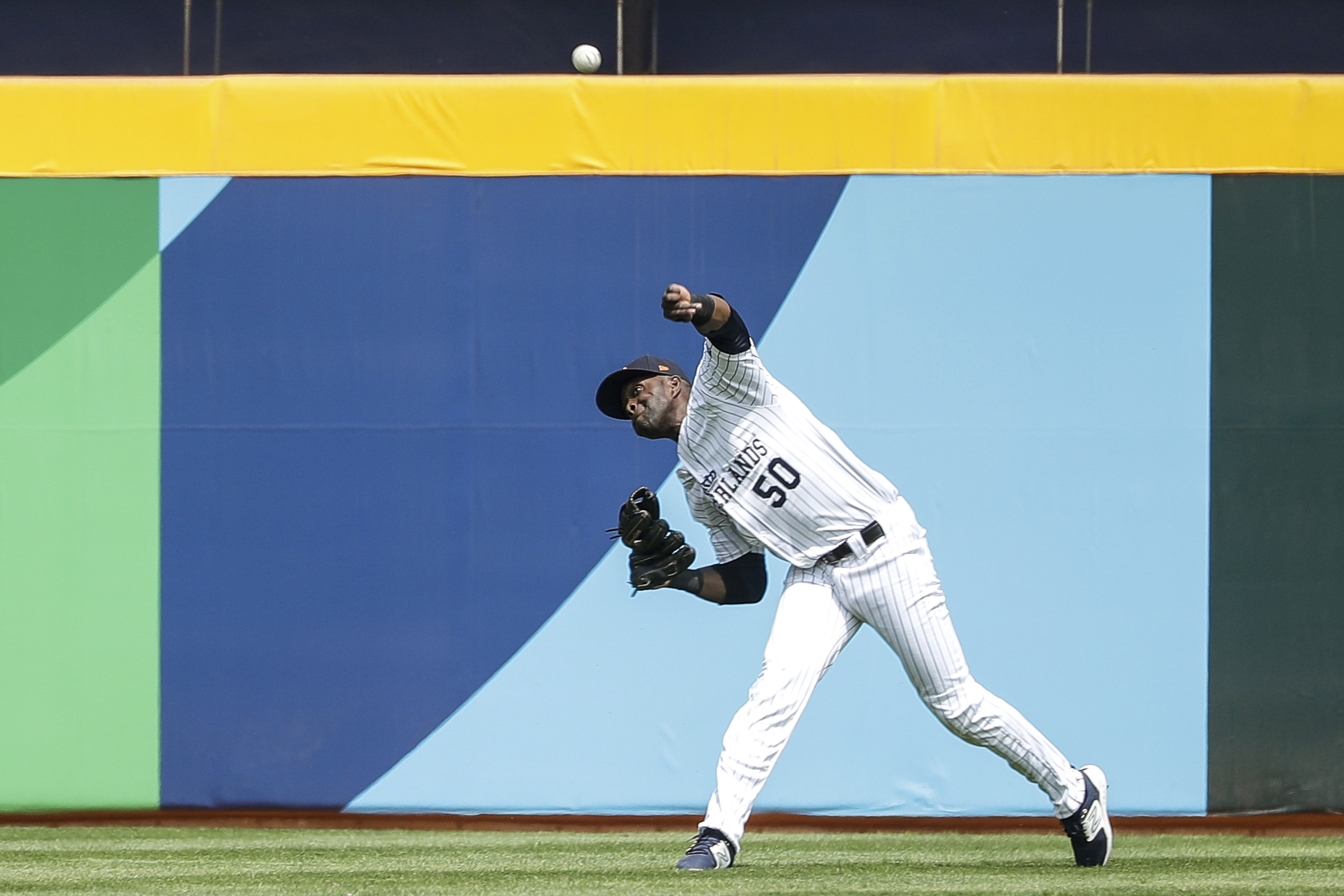 Dutch outfielder Roger Bernadina throws the ball during a World Baseball Classic Group A match against Panama, at Taichung Intercontinental Stadium, in Taichung, Taiwan, on March 9, 2023. (AP Photo/I-Hwa Cheng)