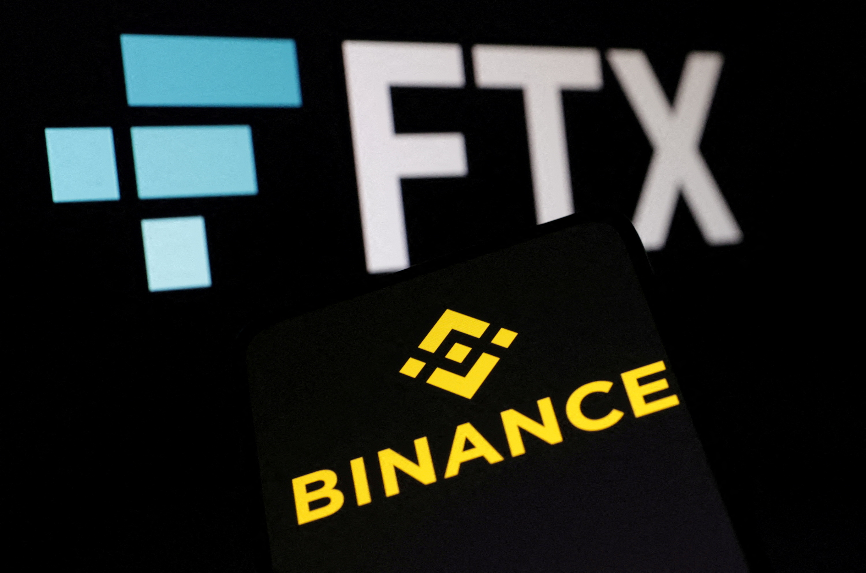 FILE PHOTO: FILE PHOTO: Binance and FTX logos are seen in this illustration taken, November 8, 2022. REUTERS/Dado Ruvic/Illustration/File Photo/File Photo
