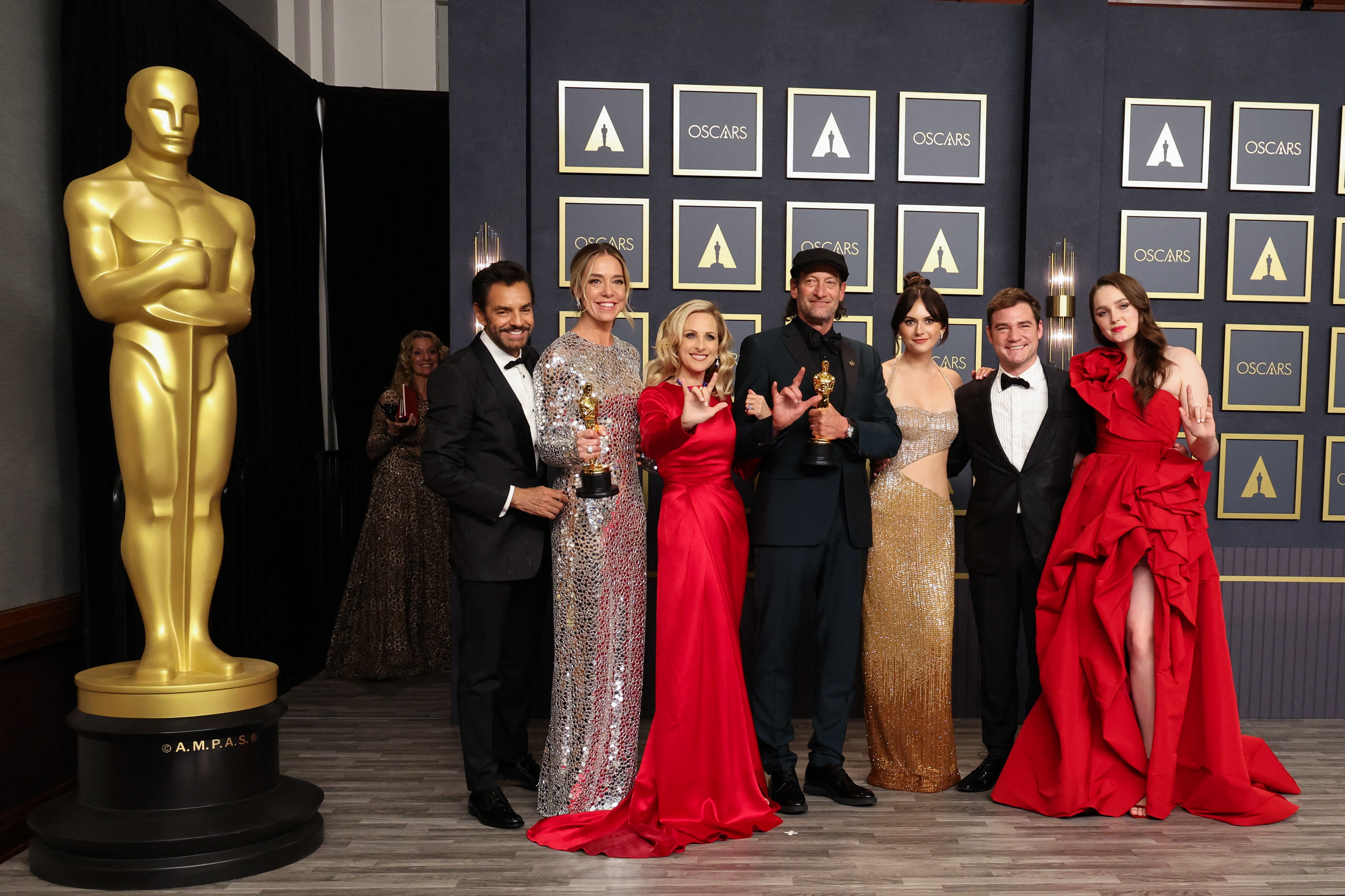 The cast and crew pose with their Oscars for Best Picture for "CODA" in the photo room during the 94th Academy Awards in Hollywood, Los Angeles, California, US, March 27, 2022. REUTERS/Mario Anzuoni