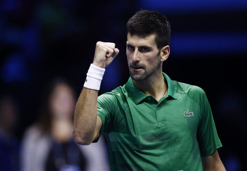 FILE PHOTO: Serbian tennis player Novak Djokovic celebrates after winning his group stage match against Russian Daniil Medvedev for the ATP Finals at the Pala Alpitour stadium in Turin, Italy.  November 18, 2022. REUTERS/Guglielmo Mangiapane/File