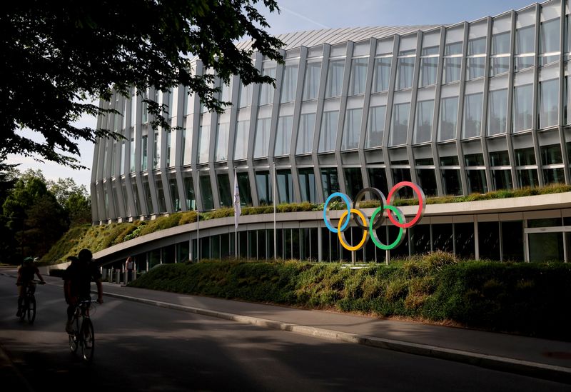 FILE PHOTO: The Olympic rings are pictured in front of the International Olympic Committee (IOC) headquarters in Lausanne, Switzerland, May 17, 2022. REUTERS/Denis Balibouse