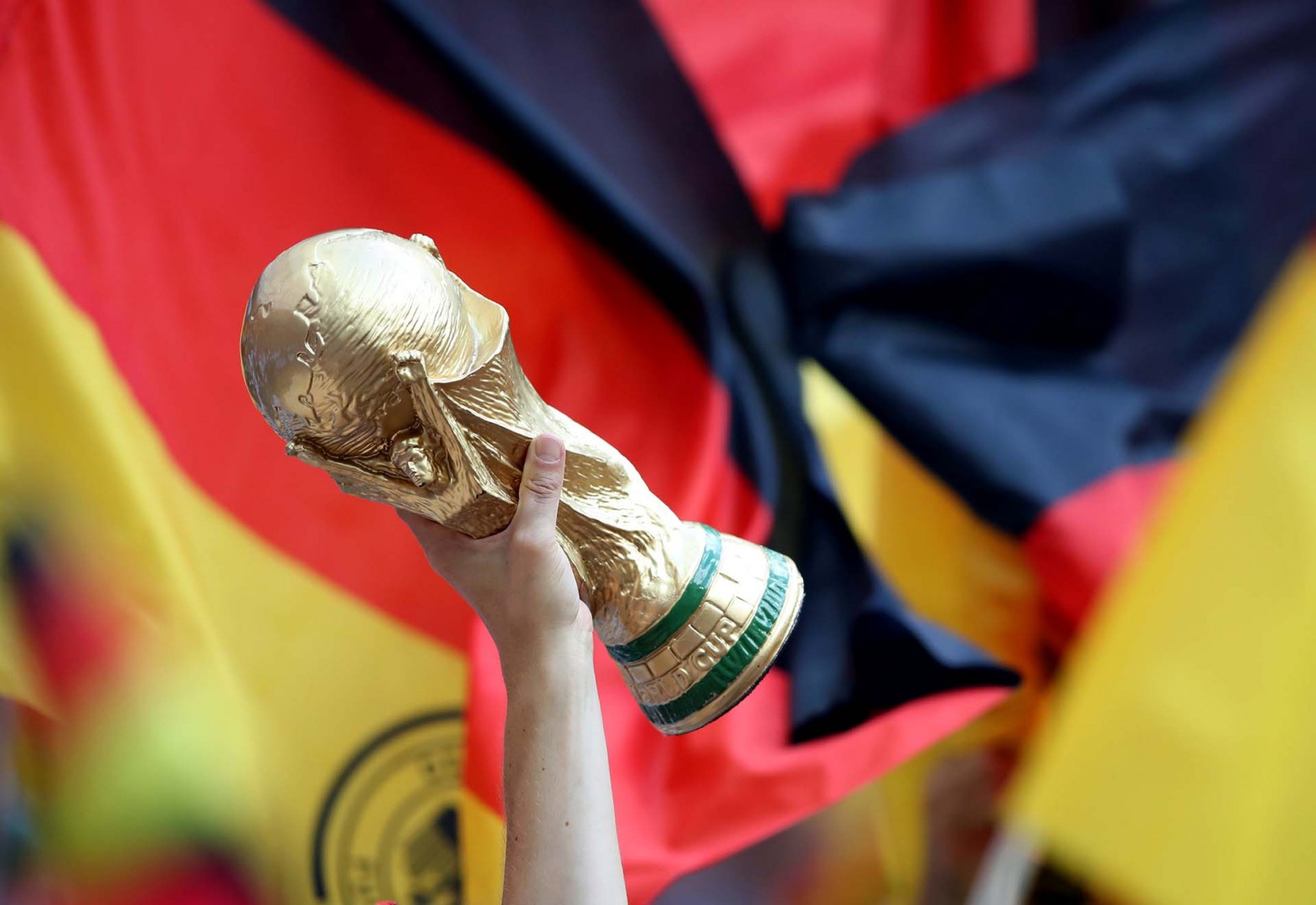 Soccer Football - World Cup - Group F - Germany vs Mexico - Luzhniki Stadium, Moscow, Russia - June 17, 2018   Fan holds up a replica World Cup trophy inside the stadium before the match   REUTERS/Carl Recine