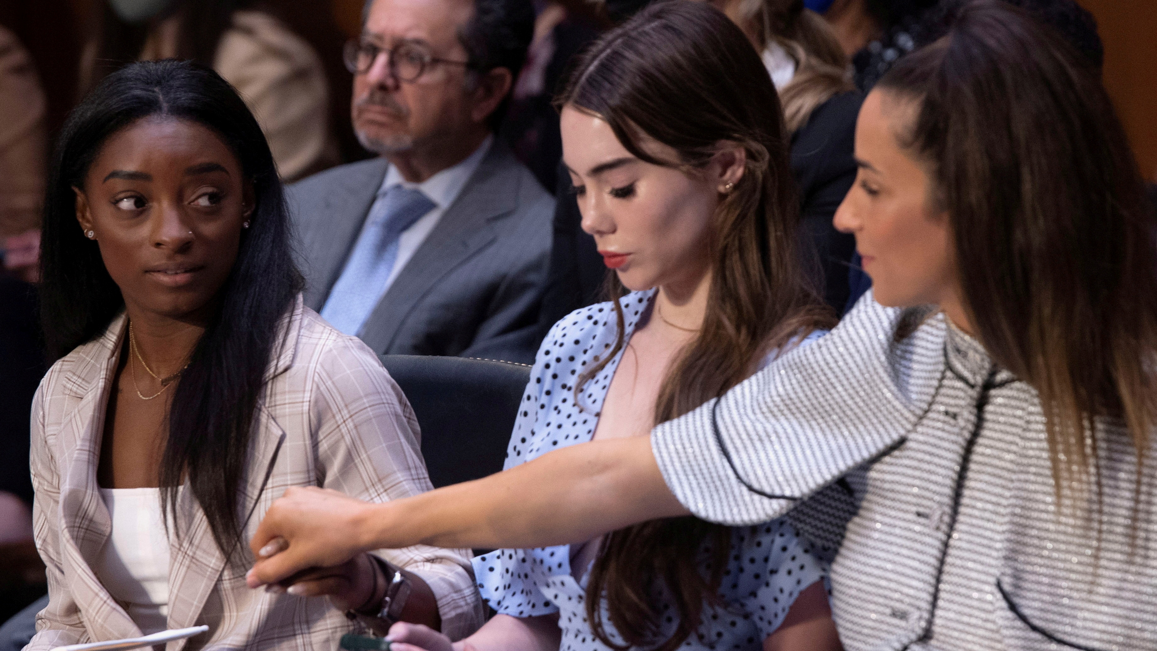 U.S. Olympic gymnasts Simone Biles, McKayla Maroney, Aly Raisman and Maggie Nichols (not pictured) arrive to testify during a Senate Judiciary hearing about the Inspector General's report on the FBI handling of the Larry Nassar investigation of sexual abuse of Olympic gymnasts, on Capitol Hill, in Washington, D.C., U.S., September 15, 2021. Saul Loeb/Pool via REUTERS TPX IMAGES OF THE DAY