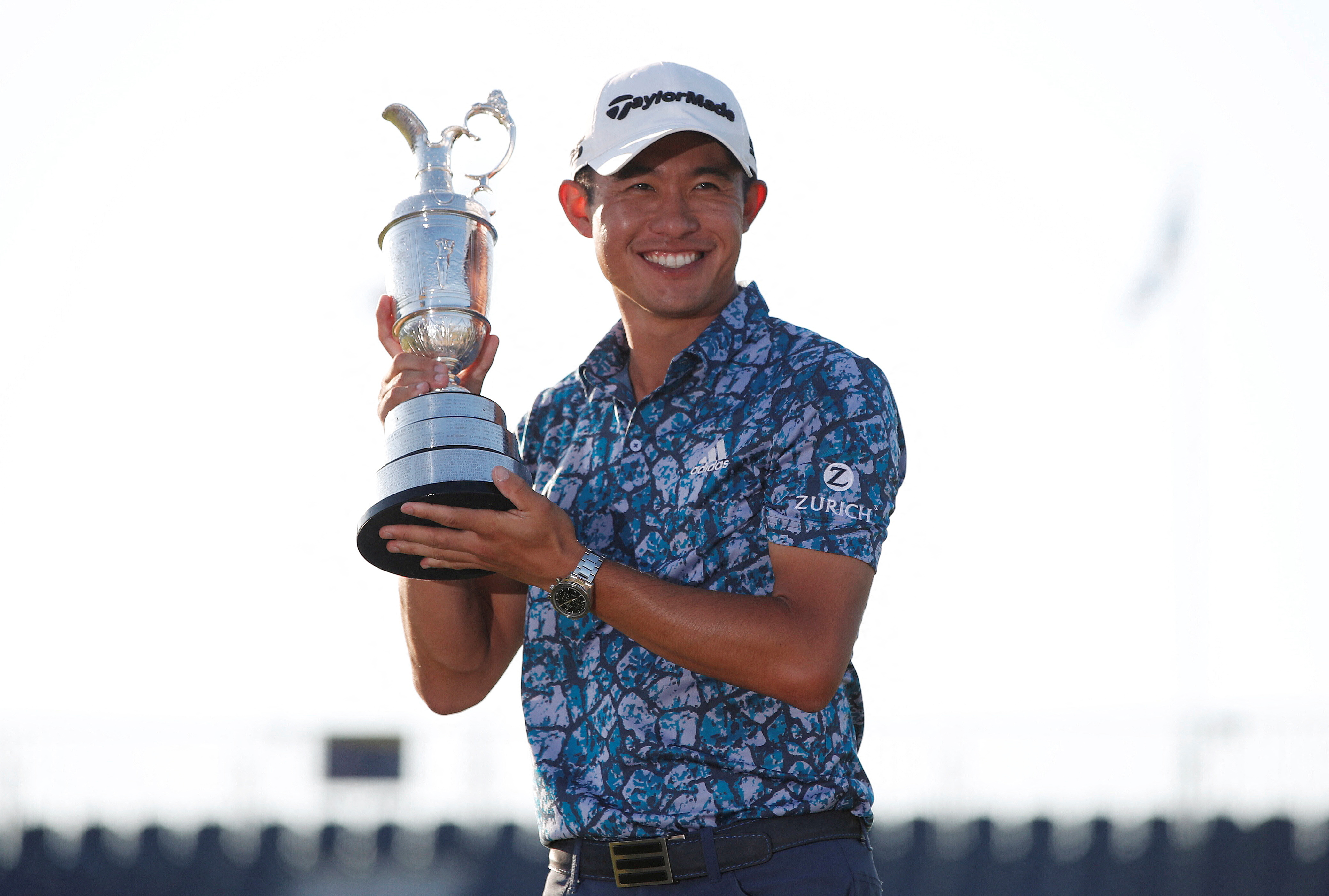 FILE PHOTO: Golf - The 149th Open Championship - Royal St George's, Sandwich, Britain - July 18, 2021 Collin Morikawa of the U.S. celebrates with the Claret Jug after winning The Open Championship REUTERS/Paul Childs/File Photo