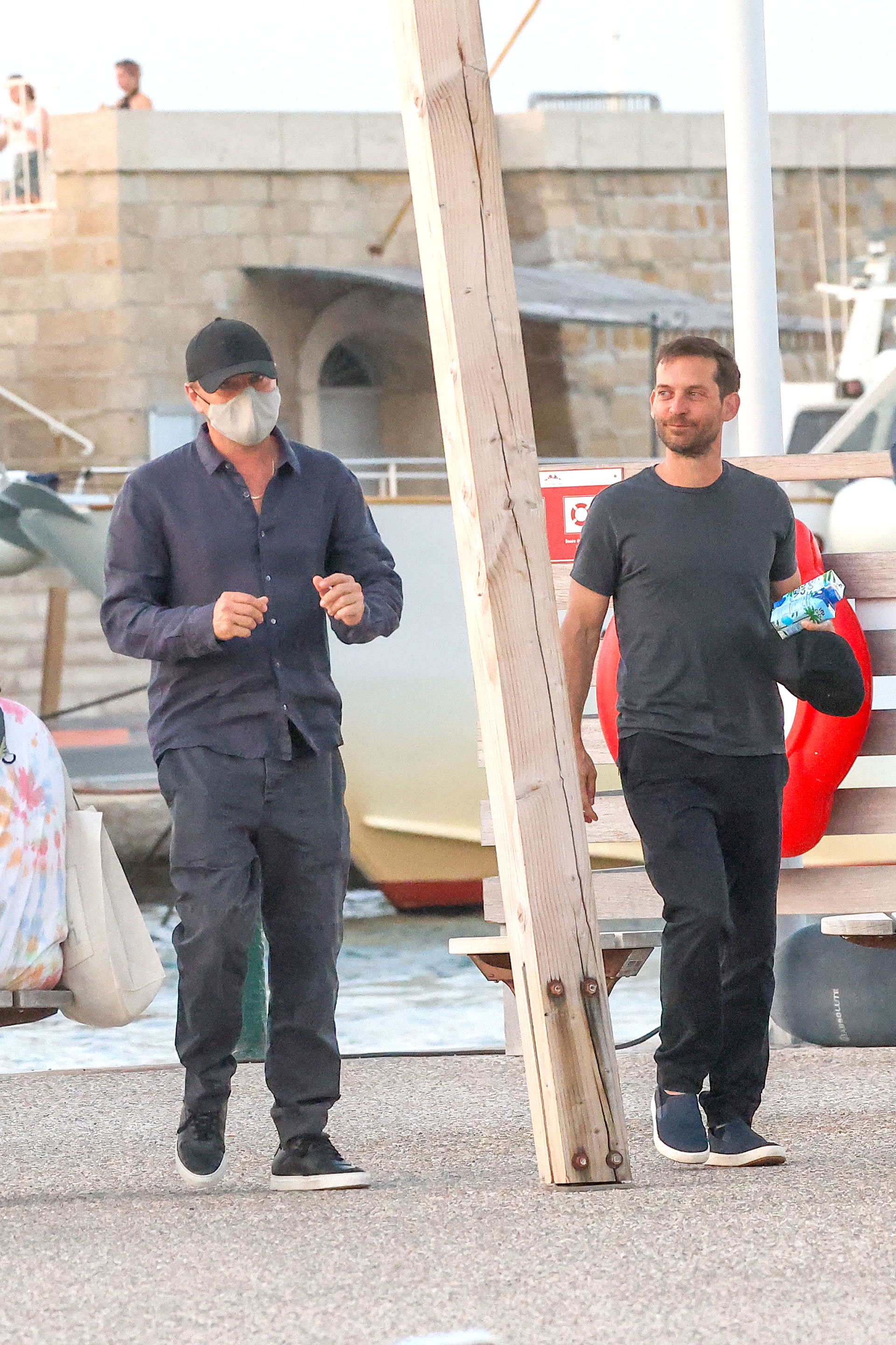 Leonardo DiCaprio and Tobey Maguire stroll through the streets of Saint-Tropez during their trip with friends