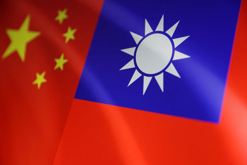 FILE PHOTO: Flags of China and Taiwan in an illustration taken on August 6, 2022. REUTERS/Dado Ruvic