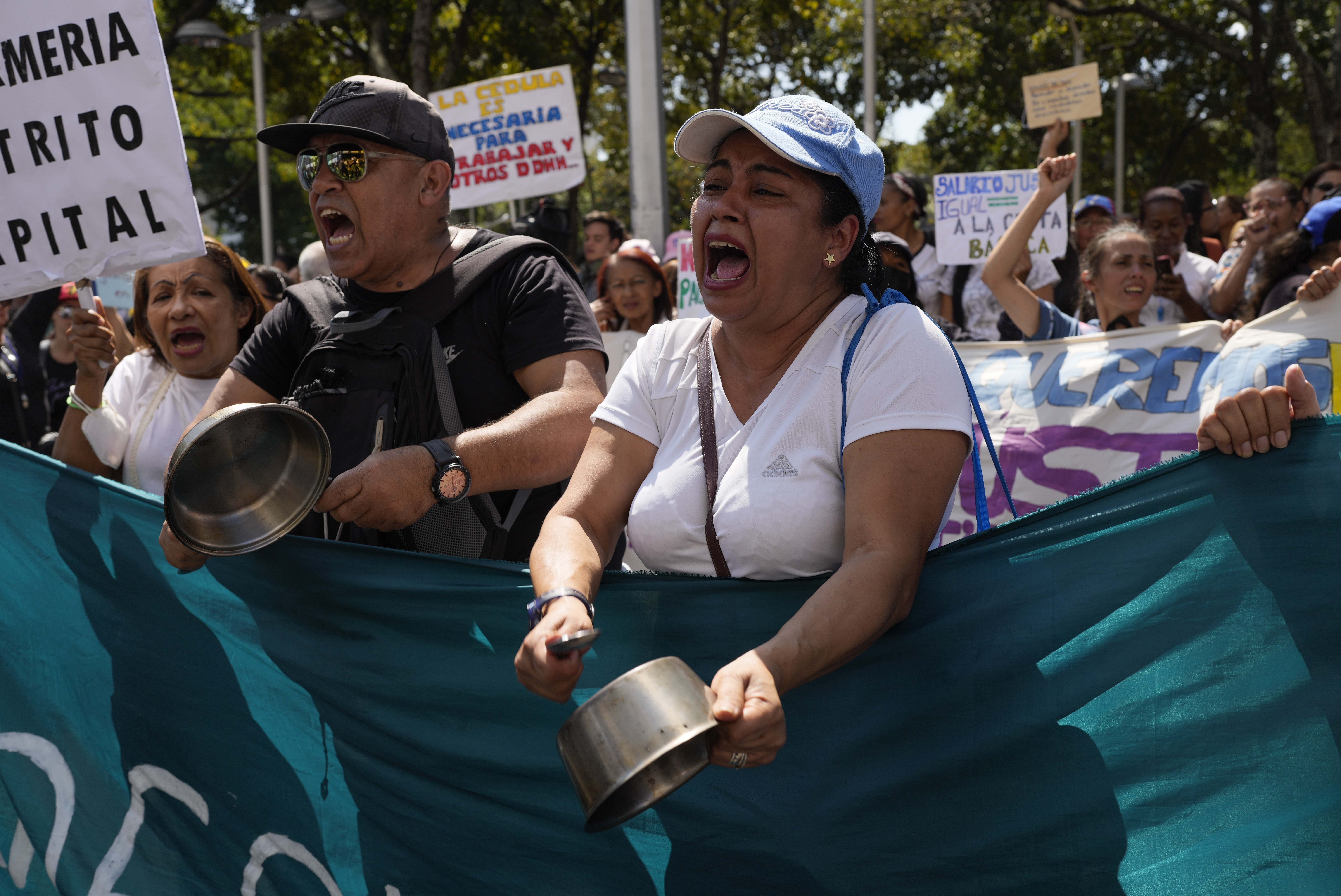 In recent weeks, a severe devaluation of the local currency, the bolivar, has sparked a wave of protests in Caracas.  (AP Photo/Ariana Cubillos)