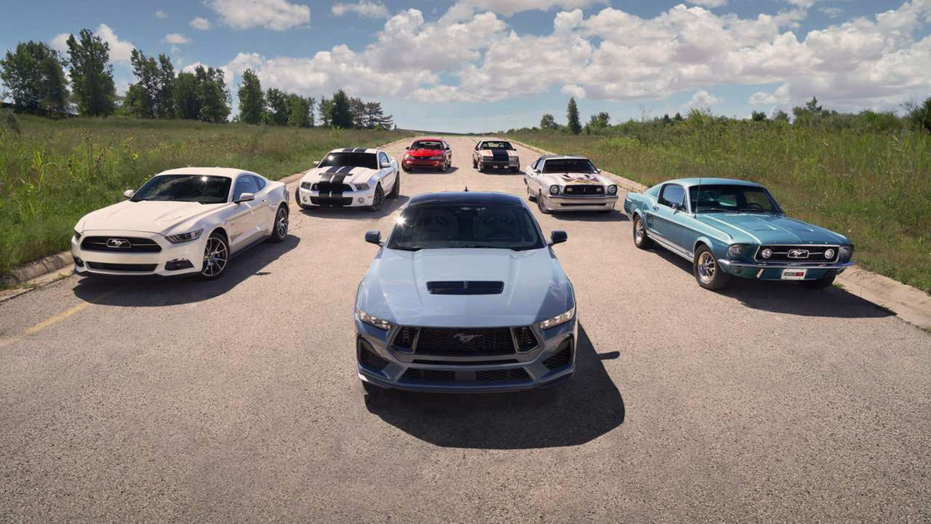 All Mustangs in one photo.  Nearly 60 years of classicism leading up to the Pony Car concept, cars weren't quite as big as Muscle Cars in the 1960s.