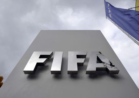 ZURICH, SWITZERLAND - OCTOBER 09:  A FIFA logo next to the entrance at the FIFA headquarters on October 9, 2015 in Zurich, Switzerland. On Thursday, FIFA's Ethics Committee provisionally banned FIFA President Joseph S. Blatter from all football activities for the duration of 90 days.  (Photo by Harold Cunningham/Getty Images)