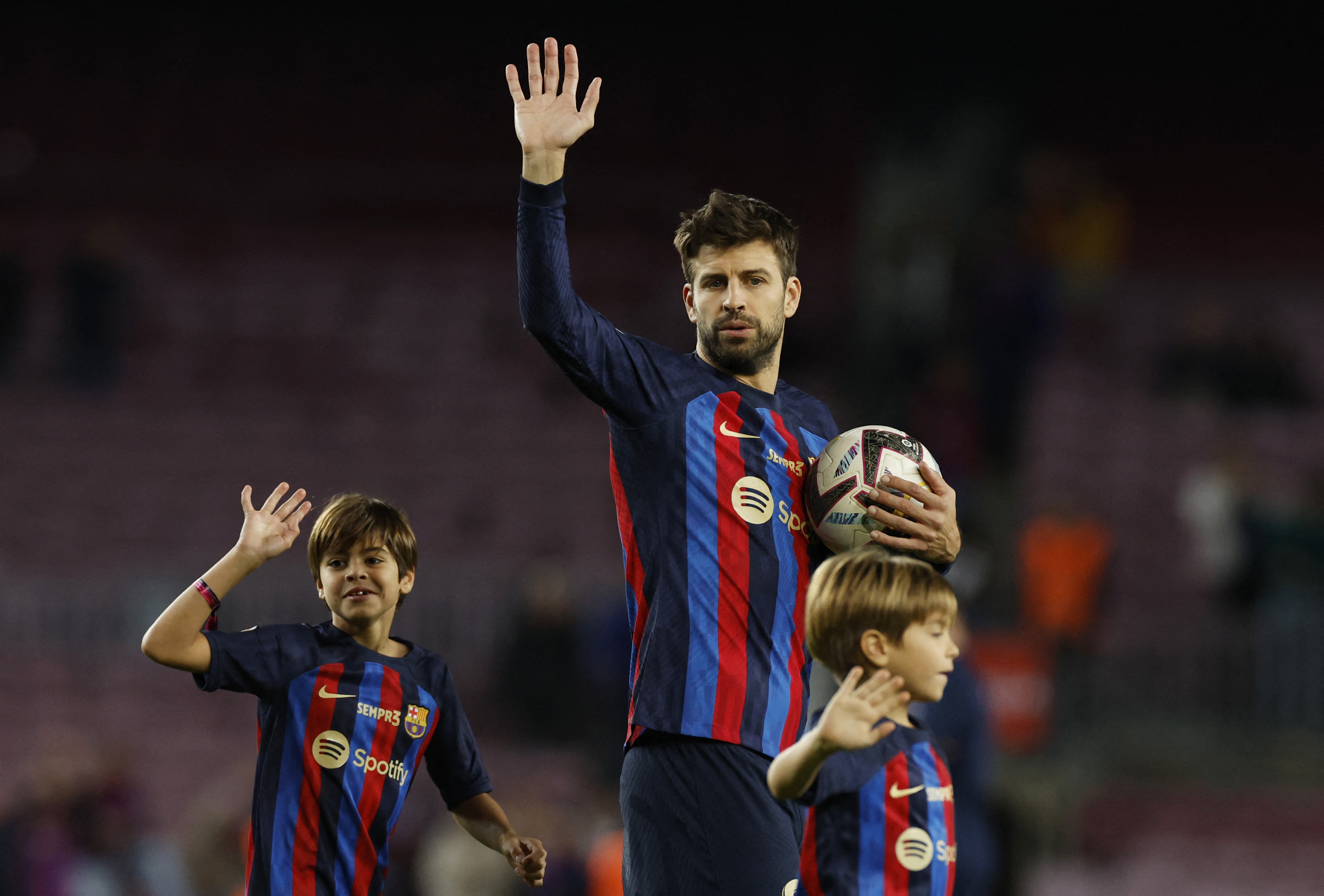 Soccer Football - LaLiga - FC Barcelona v Almeria - Camp Nou, Barcelona, Spain - November 5, 2022 FC Barcelona's Gerard Pique with his children after playing his last home game for FC Barcelona REUTERS/Albert Gea