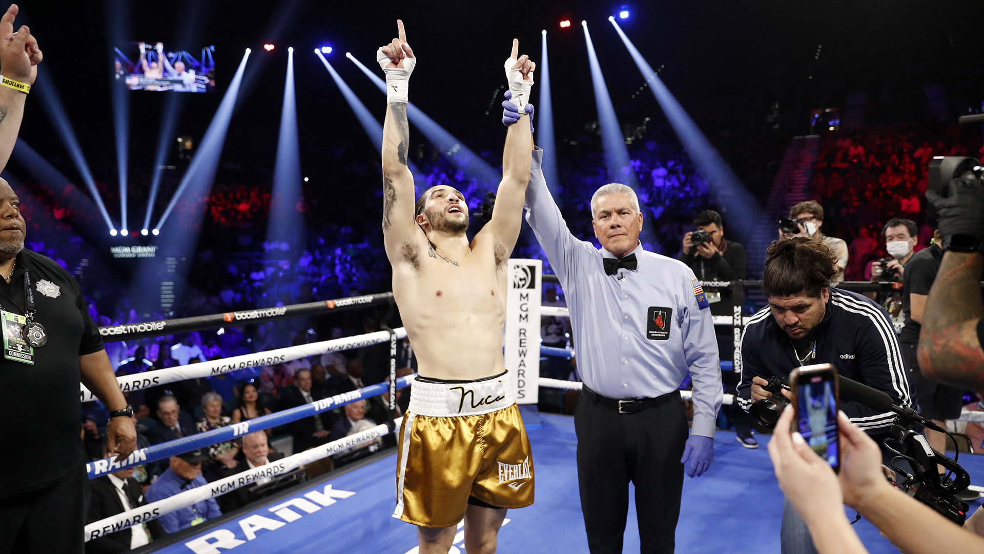 LAS VEGAS, NEVADA - APRIL 30: Nico Ali Walsh celebrates next to referee Russell Mora after knocking out Alejandro Ibarra in the first round of a middleweight bout at MGM Grand Garden Arena on April 30, 2022 in Las Vegas, Nevada. Walsh is the grandson of Muhammad Ali.   Steve Marcus/Getty Images/AFP (Photo by Steve Marcus / GETTY IMAGES NORTH AMERICA / Getty Images via AFP)