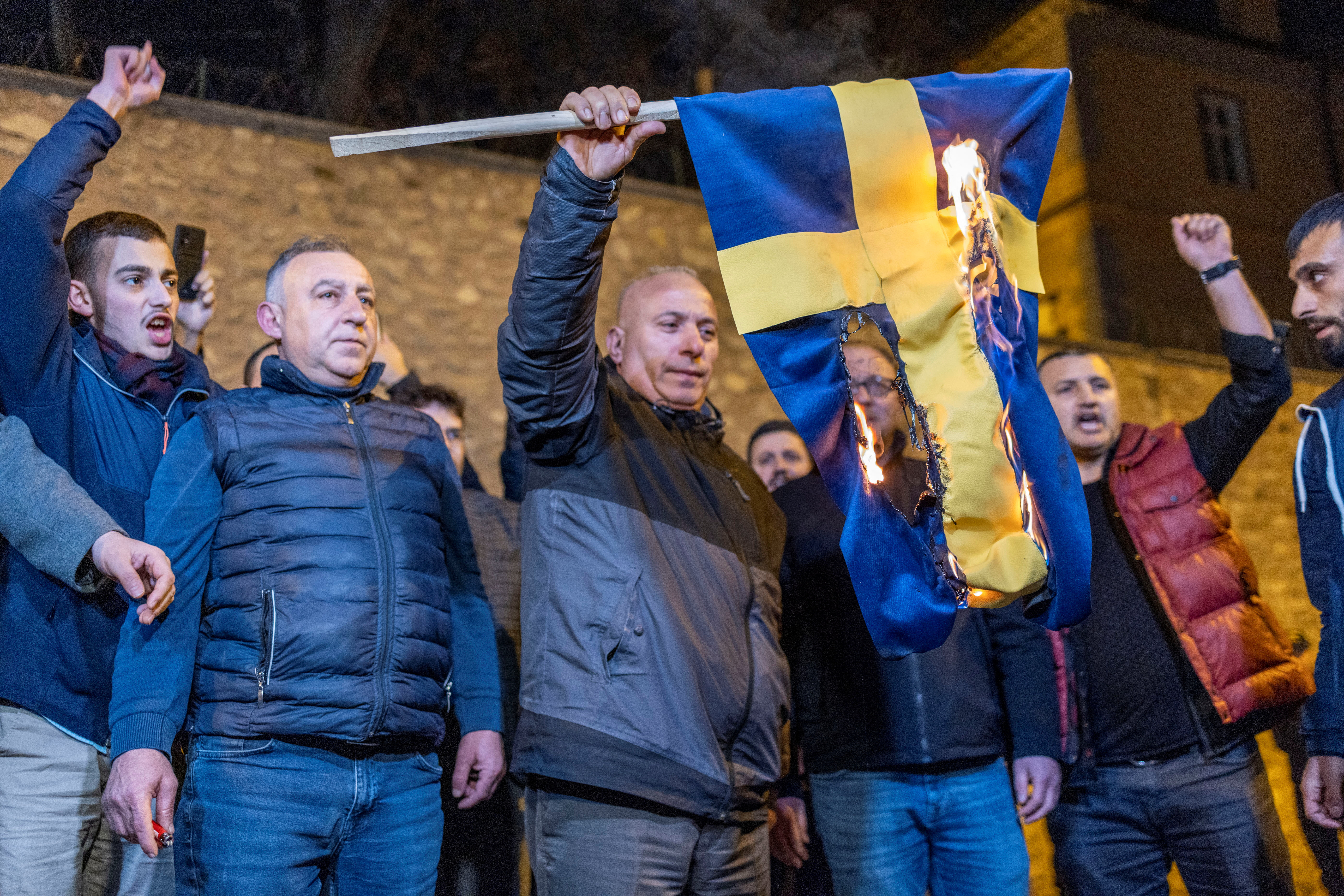 Protesters burn the Swedish flag in front of the Swedish consulate in Stockholm (REUTERS/Umit Bektas)