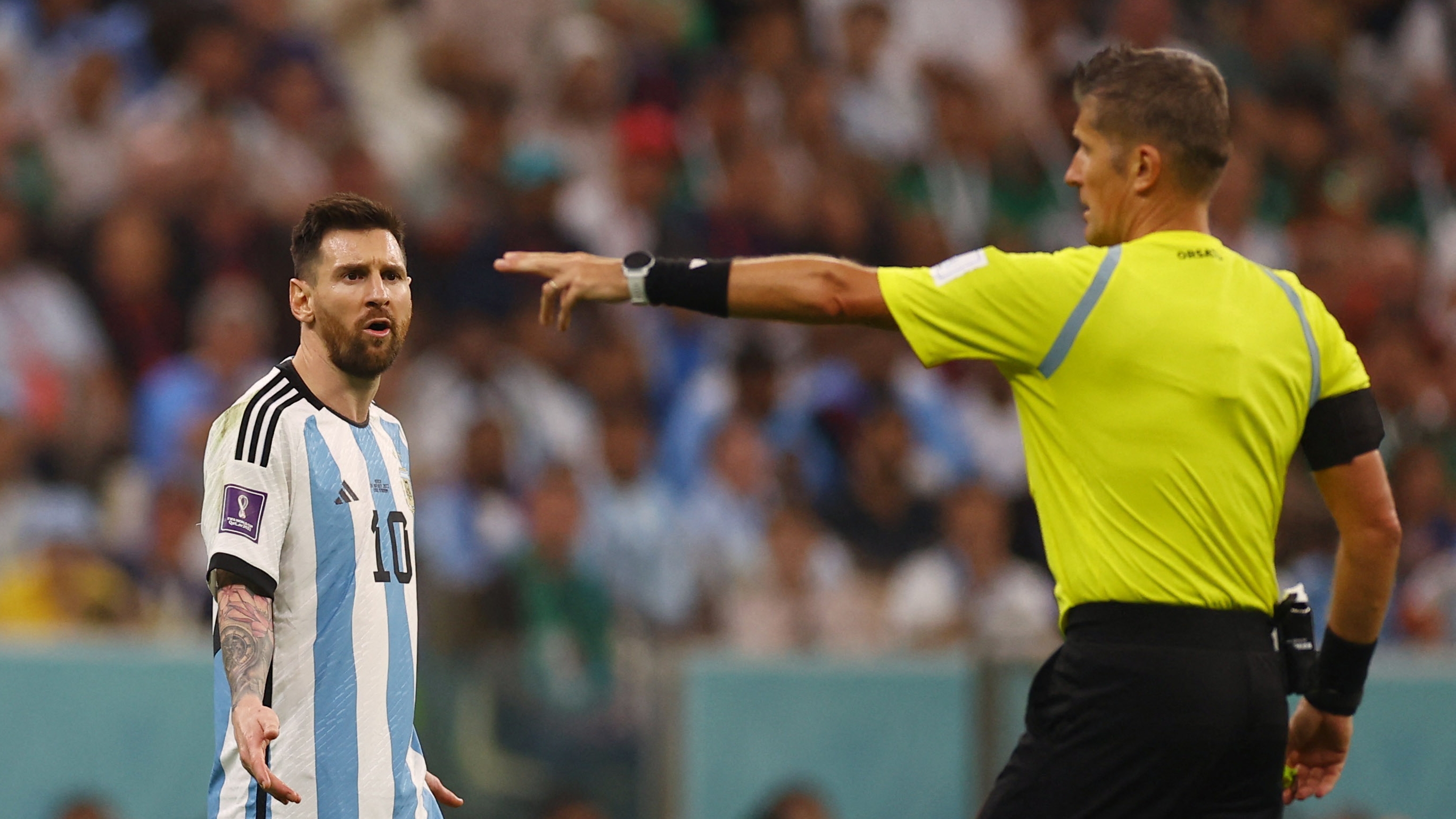 Soccer Football - FIFA World Cup Qatar 2022 - Group C - Argentina v Mexico - Lusail Stadium, Lusail, Qatar - November 26, 2022 Argentina's Lionel Messi remonstrates with the referee Daniele Orsato REUTERS/Kai Pfaffenbach