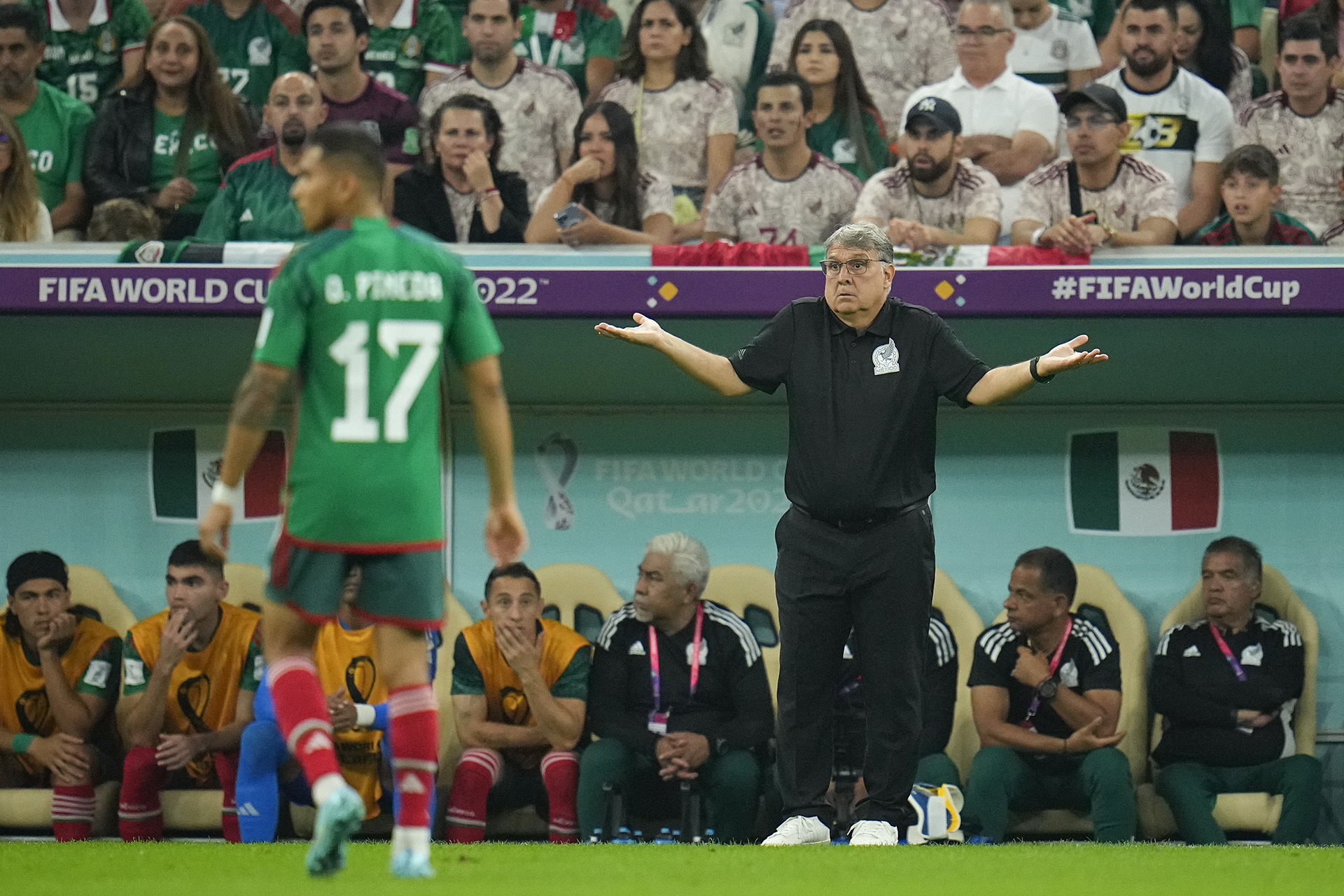 Mexico's head coach Gerardo Martino, right, signals to a player during the World Cup group C soccer match between Saudi Arabia and Mexico, at the Lusail Stadium in Lusail, Qatar, Wednesday, Nov. 30, 2022. (AP Photo/Julio Cortez)