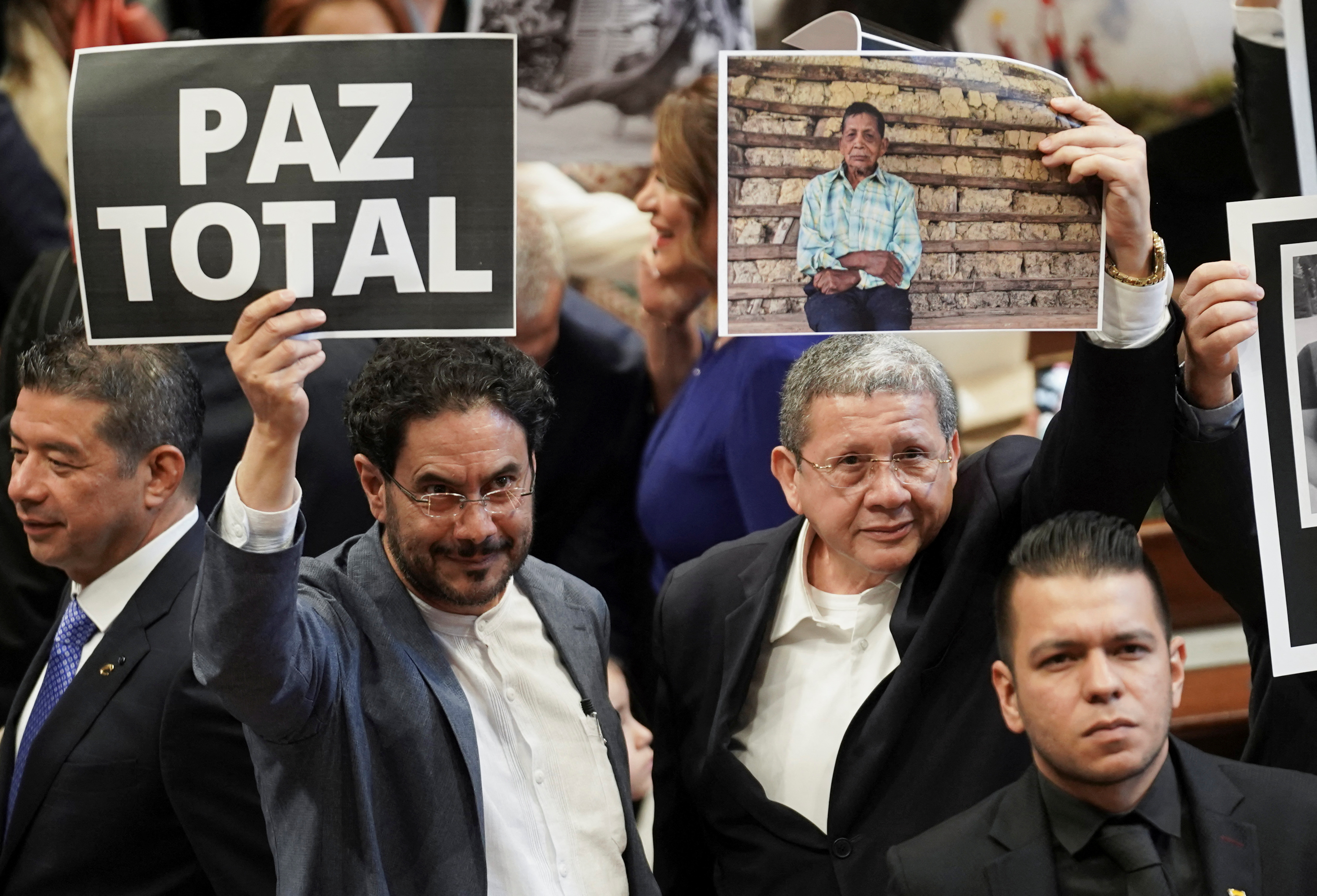 Senator Ivan Cepeda, holding a sign reading "Total peace", and senator Pablo Catatumbo attend the opening of the new session of Colombia's congress ahead of the inauguration of leftist President-elect Gustavo Petro, in Bogota, Colombia July 20, 2022. REUTERS/Nathalia Angarita