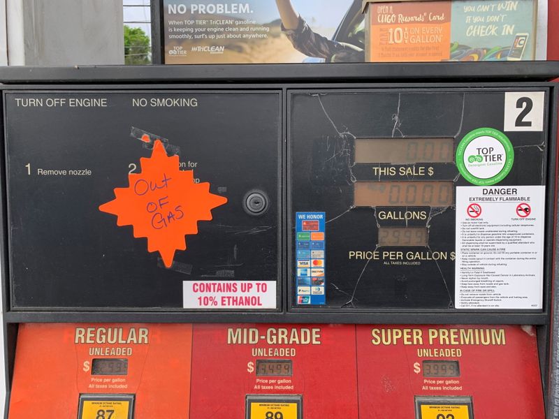 An "out of gas" sticker is seen on a gas pump at a gas station in Waynesville, North Carolina, after a gasoline supply crunch caused by the Colonial Pipeline hack, May 11, 2021. Martin Brossman via REUTERS