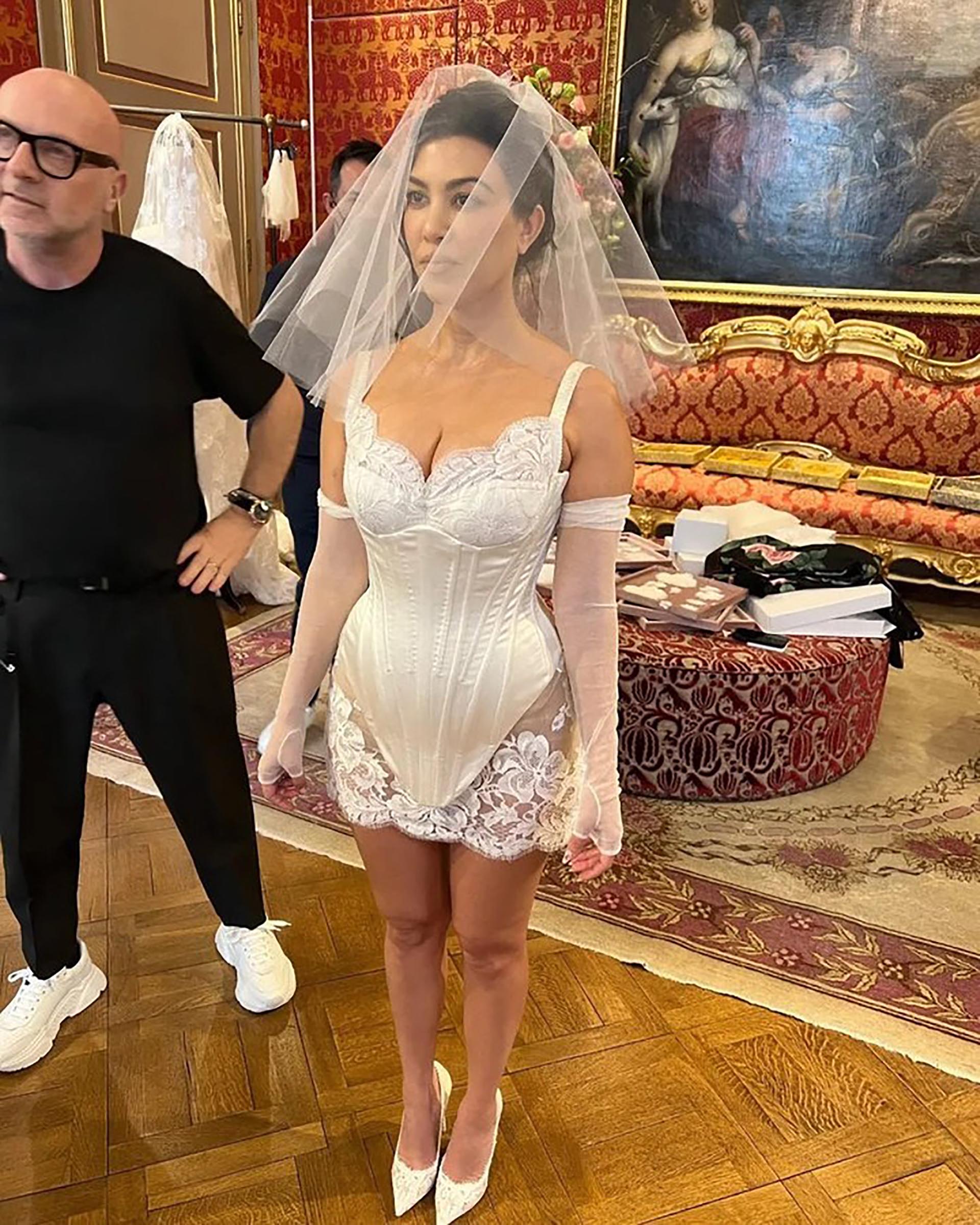 Kourtney Kardashian wears her wedding dress (@vogueweddings)