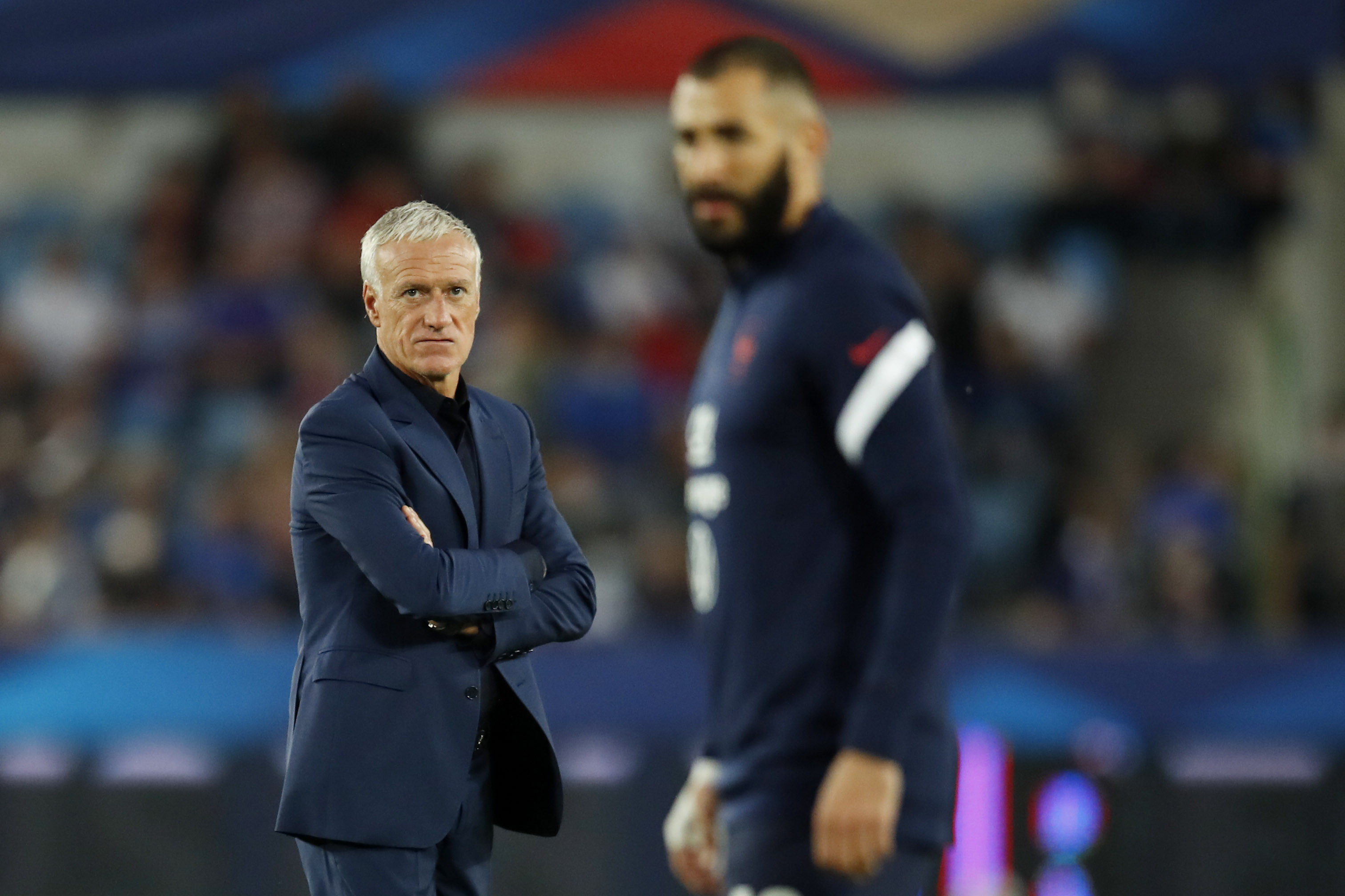 Soccer Football - World Cup - UEFA Qualifiers - Group D - France v Bosnia and Herzegovina - Stade de la Meinau, Strasbourg, France - September 1, 2021 France coach Didier Deschamps looks on before the match with France's Karim Benzema seen in the foreground REUTERS/Gonzalo Fuentes