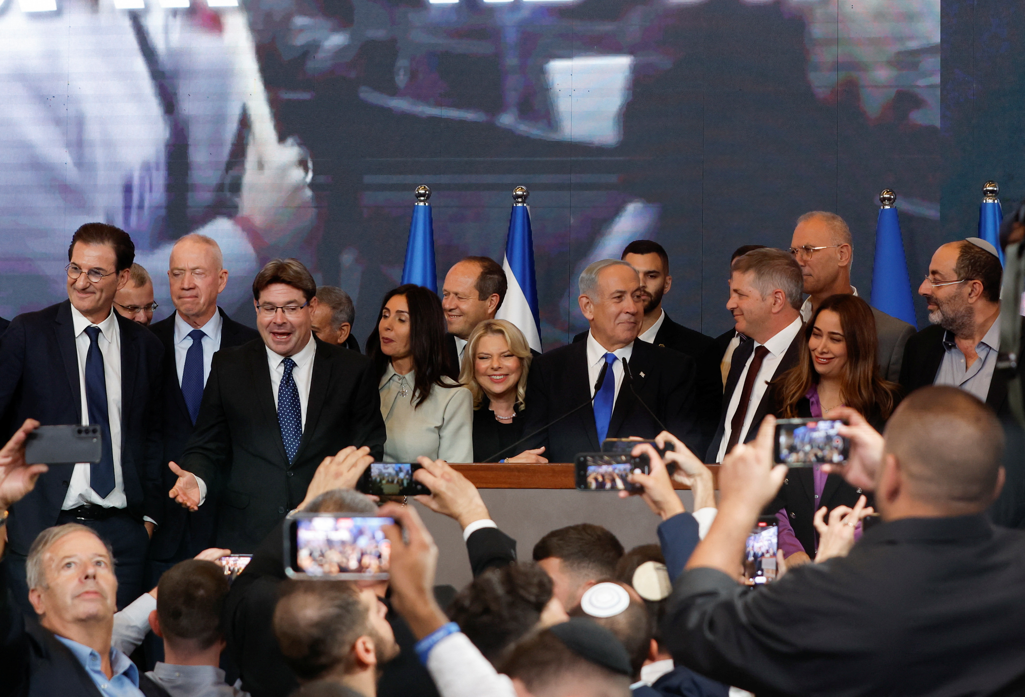 Netanyahu with his wife Sara and their entourage (Reuters)
