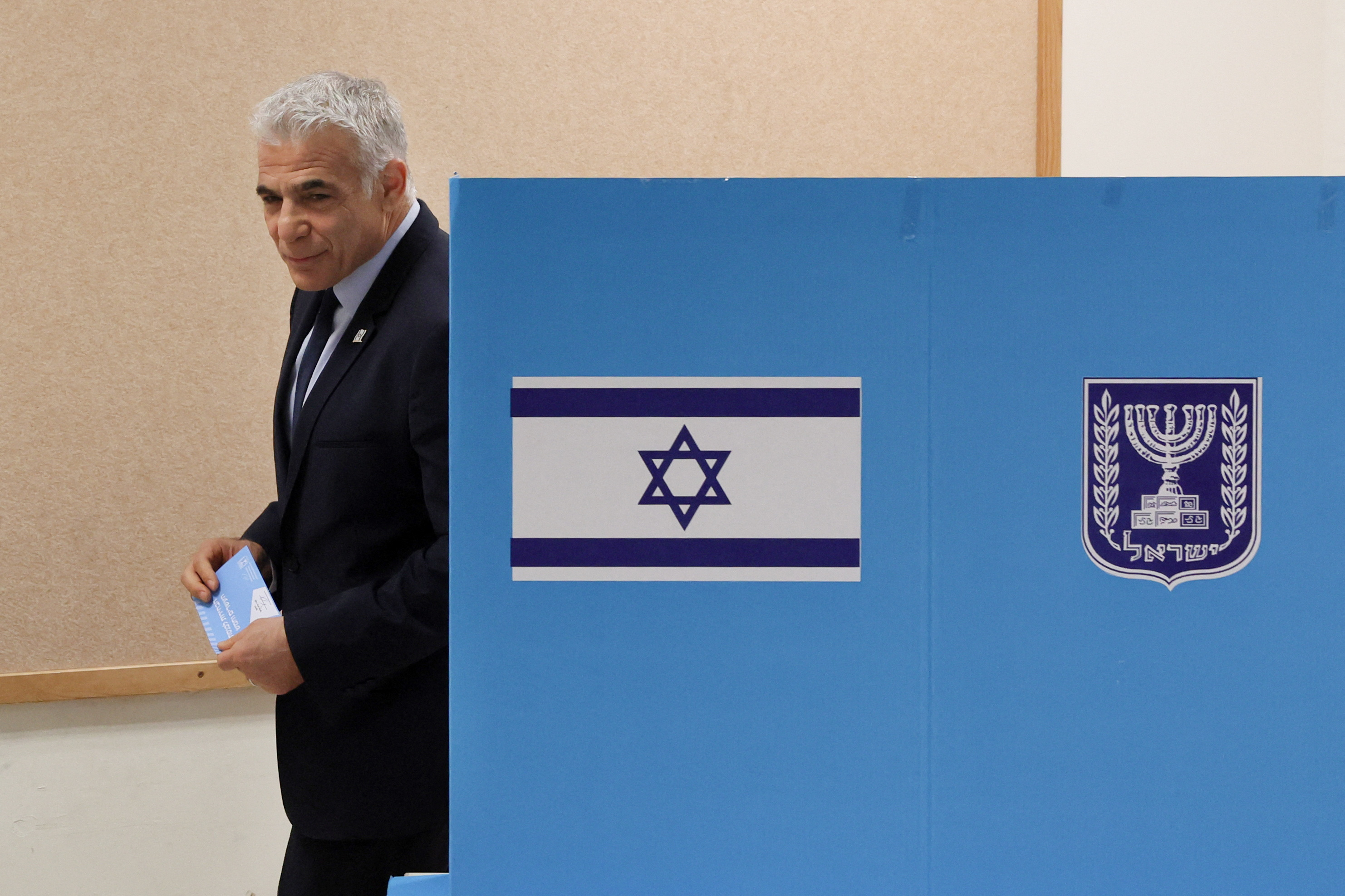 Israeli Prime Minister Yair Lapid casts his vote at a polling station in the Israeli coastal city of Tel Aviv (REUTERS)