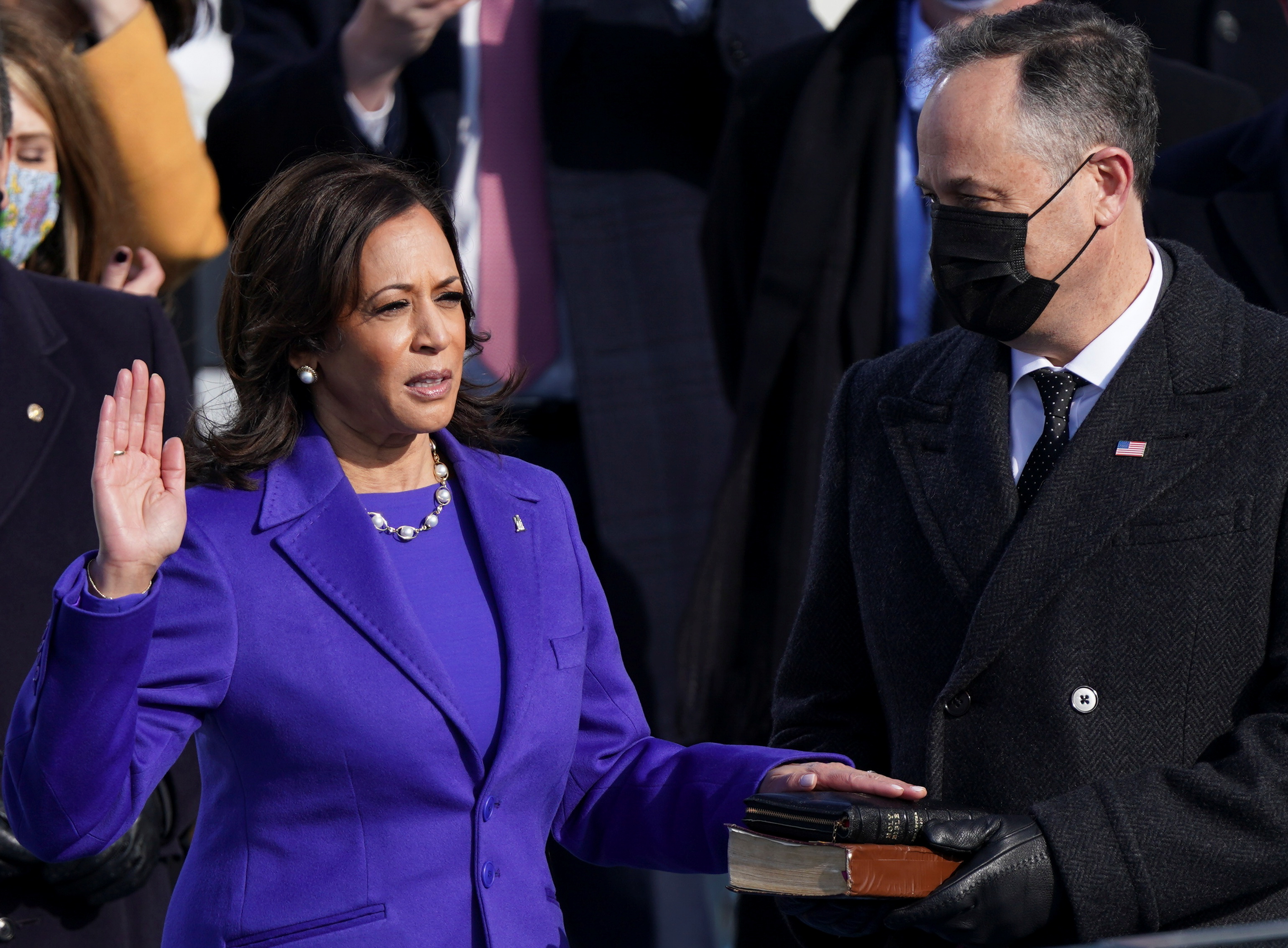 Kamala Harris is sworn in as U.S. Vice President as her spouse Doug Emhoff holds a bible during the inauguration of Joe Biden as the 46th President of the United States on the West Front of the U.S. Capitol in Washington, U.S., January 20, 2021. REUTERS/Kevin Lamarque