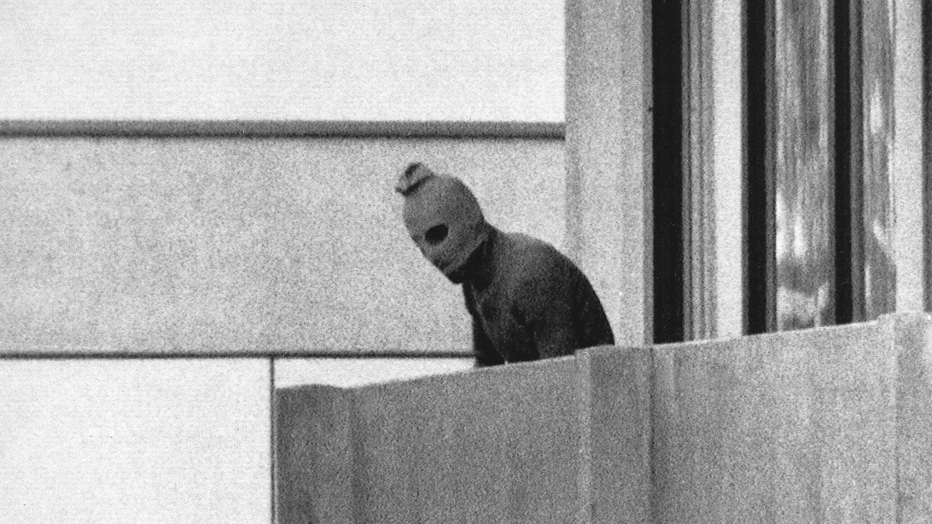 A member of the Arab commando group that captured the Israeli Olympic team members staying in the Olympic Village appeared masked on the balcony of the building where the commandos were holding the Israeli team members hostage in Munich.  , Sept. 5, 1972. (AP Photo/Kurt Strump, file)