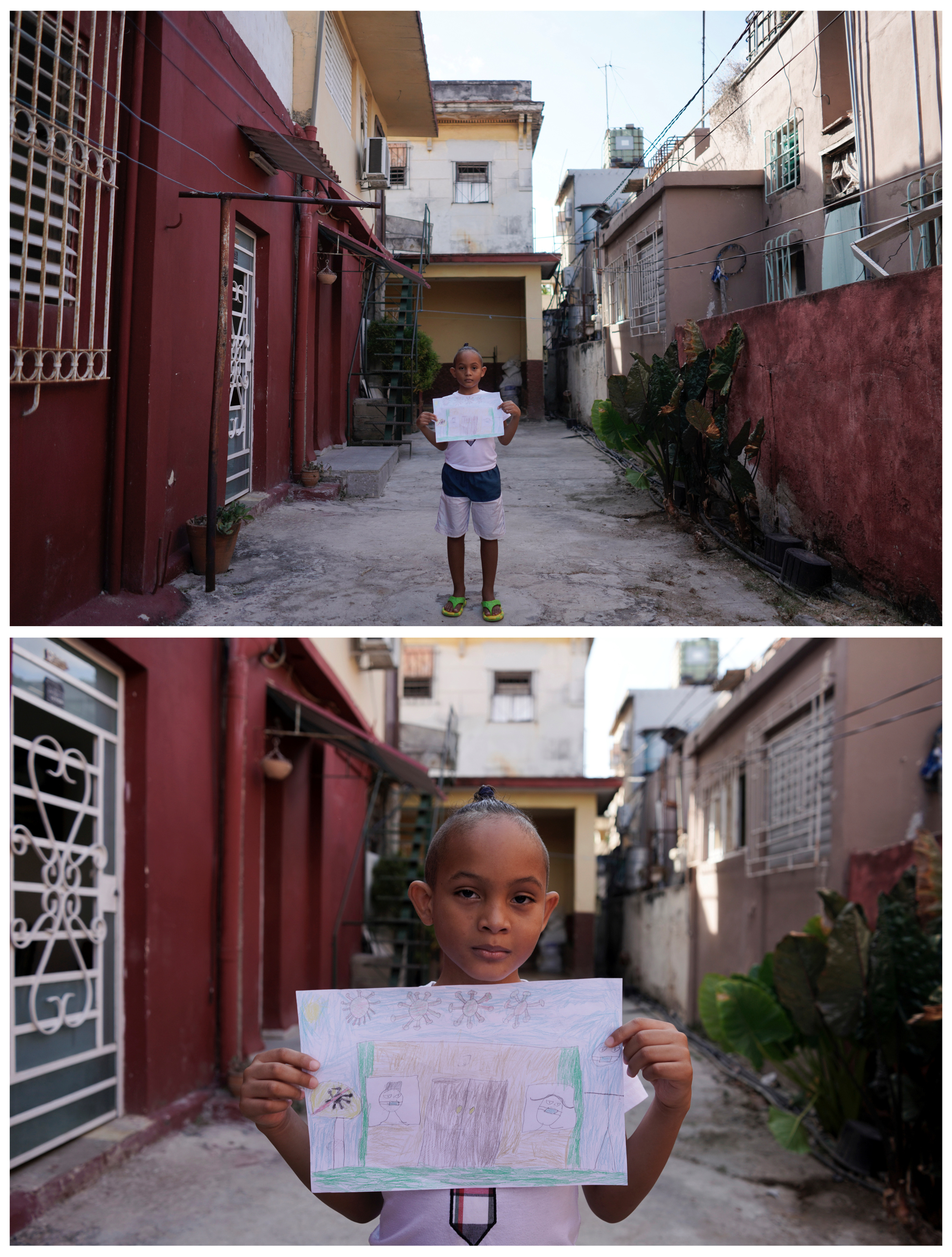 Cristofer Lucas Reyes, 7, posa en el frente de su casa en La Habana, Cuba, el 20 de abril de 2020. Cristofer se dibujó con su madre usando máscaras protectoras mientras su padre, que es médico, sale a trabajar. Hay un signo afuera que dice: