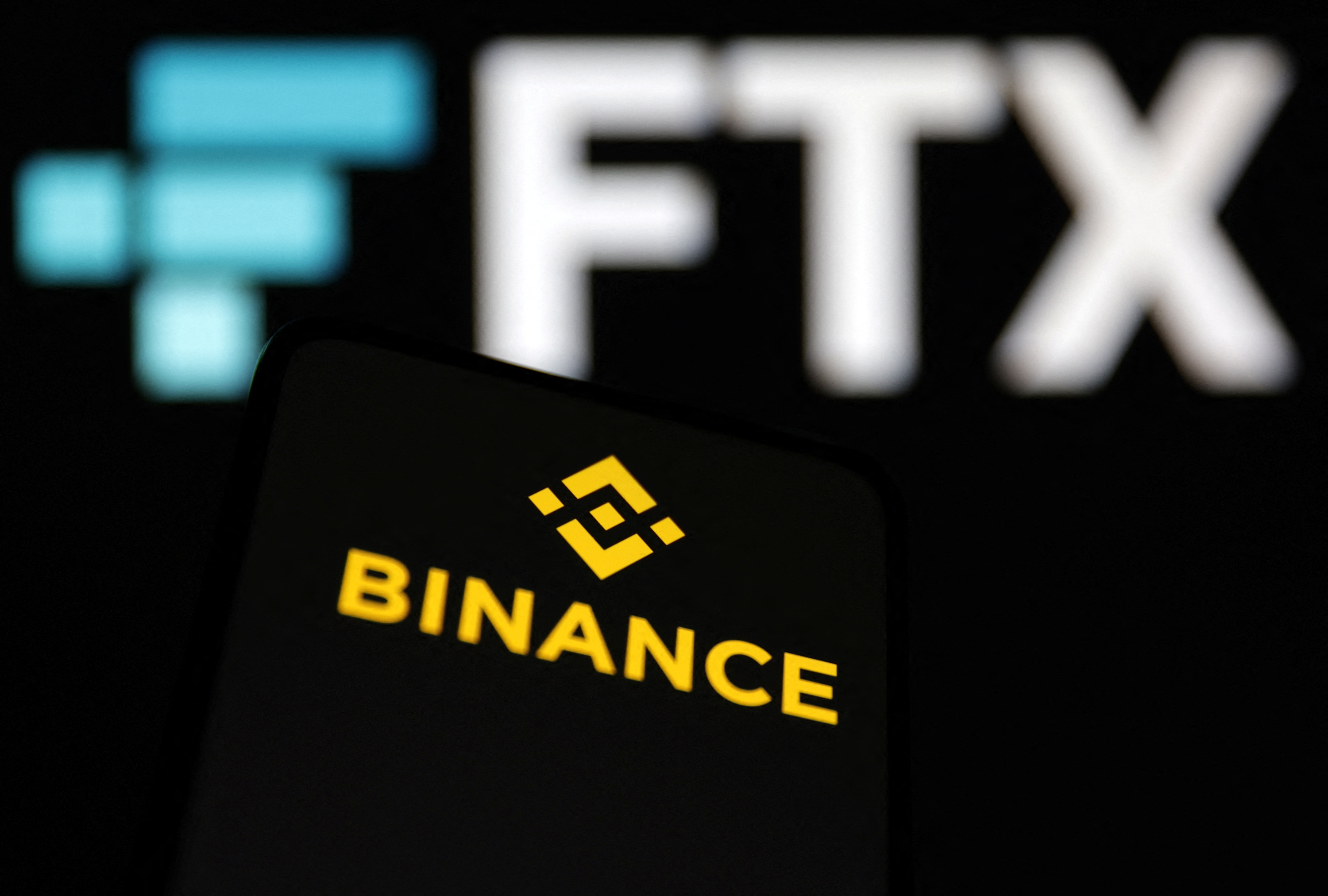 Binance and FTX logos are seen in this illustration taken, November 8, 2022. REUTERS/Dado Ruvic/Illustration
