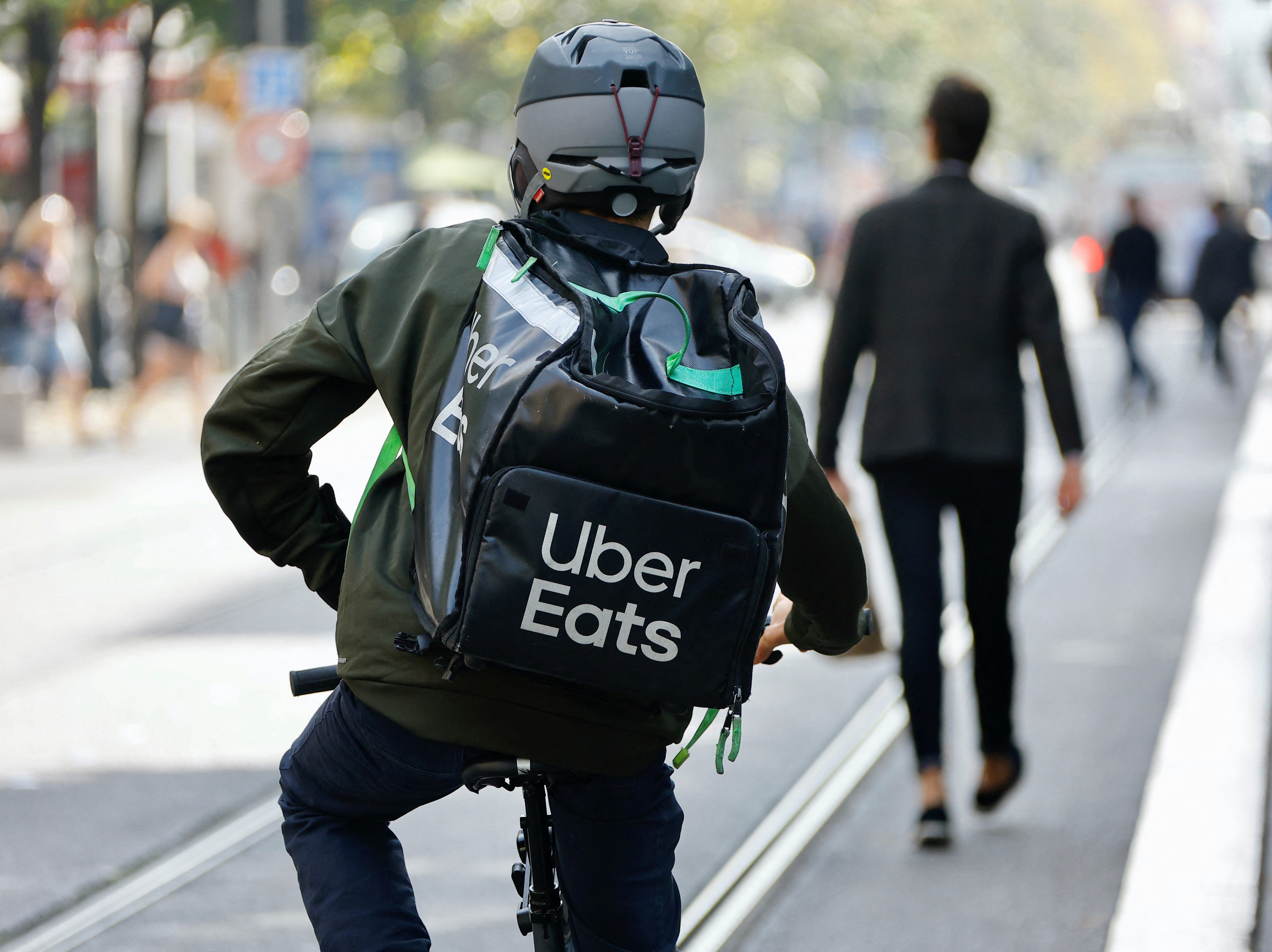Through these partnerships, Uber may seek to become less dependent on its vast fleet of independent contractors who pick up passengers and deliver food, a business model that has raised legal issues for the company in recent years.  (Reuters/Eric Gaillard)