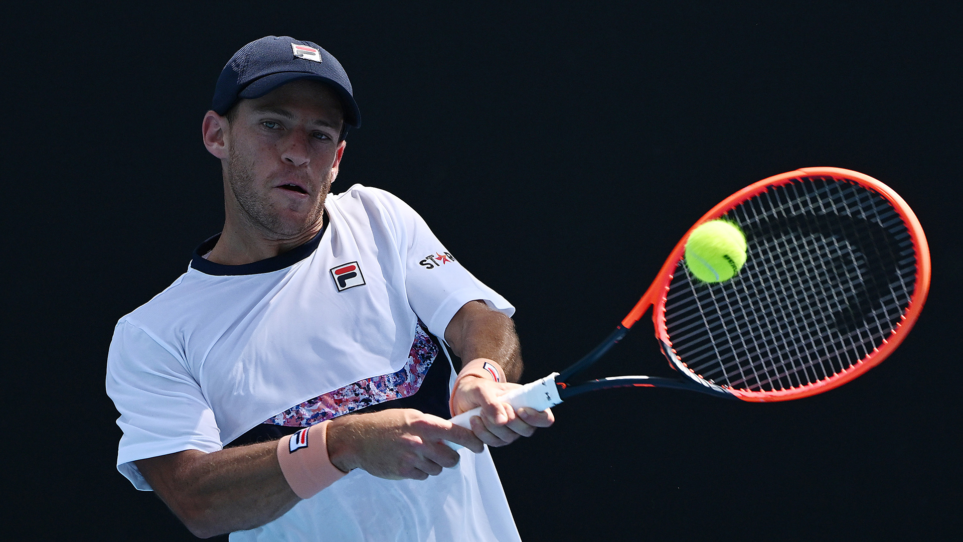 MELBOURNE, AUSTRALIA - JANUARY 17: Diego Schwartzman of Argentina plays a backhand in their round one singles match against Oleksii Krutykh of Ukraine during day two of the 2023 Australian Open at Melbourne Park on January 17, 2023 in Melbourne, Australia. (Photo by Quinn Rooney/Getty Images)